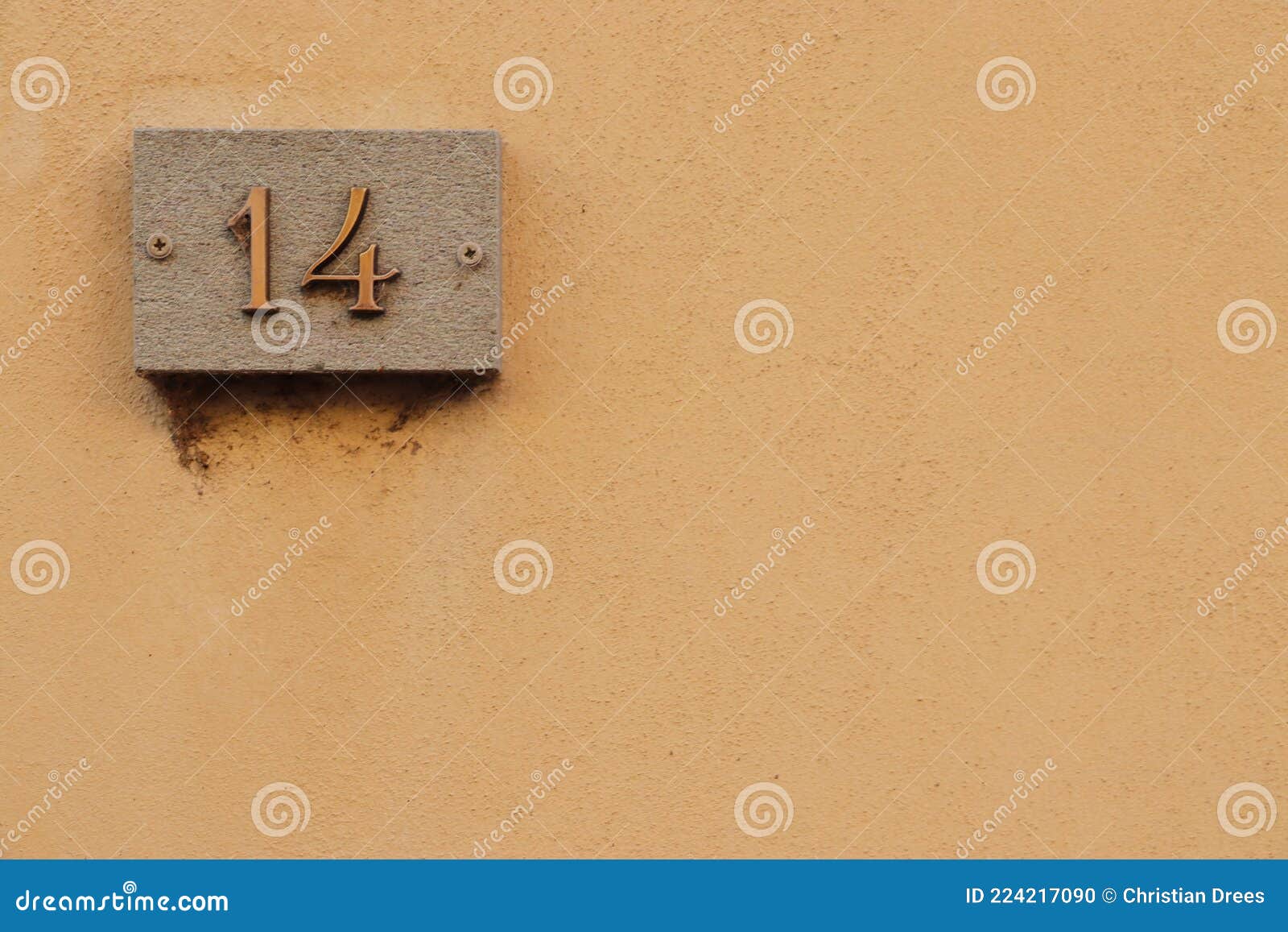 street number sign, number fourteen on the top left corner