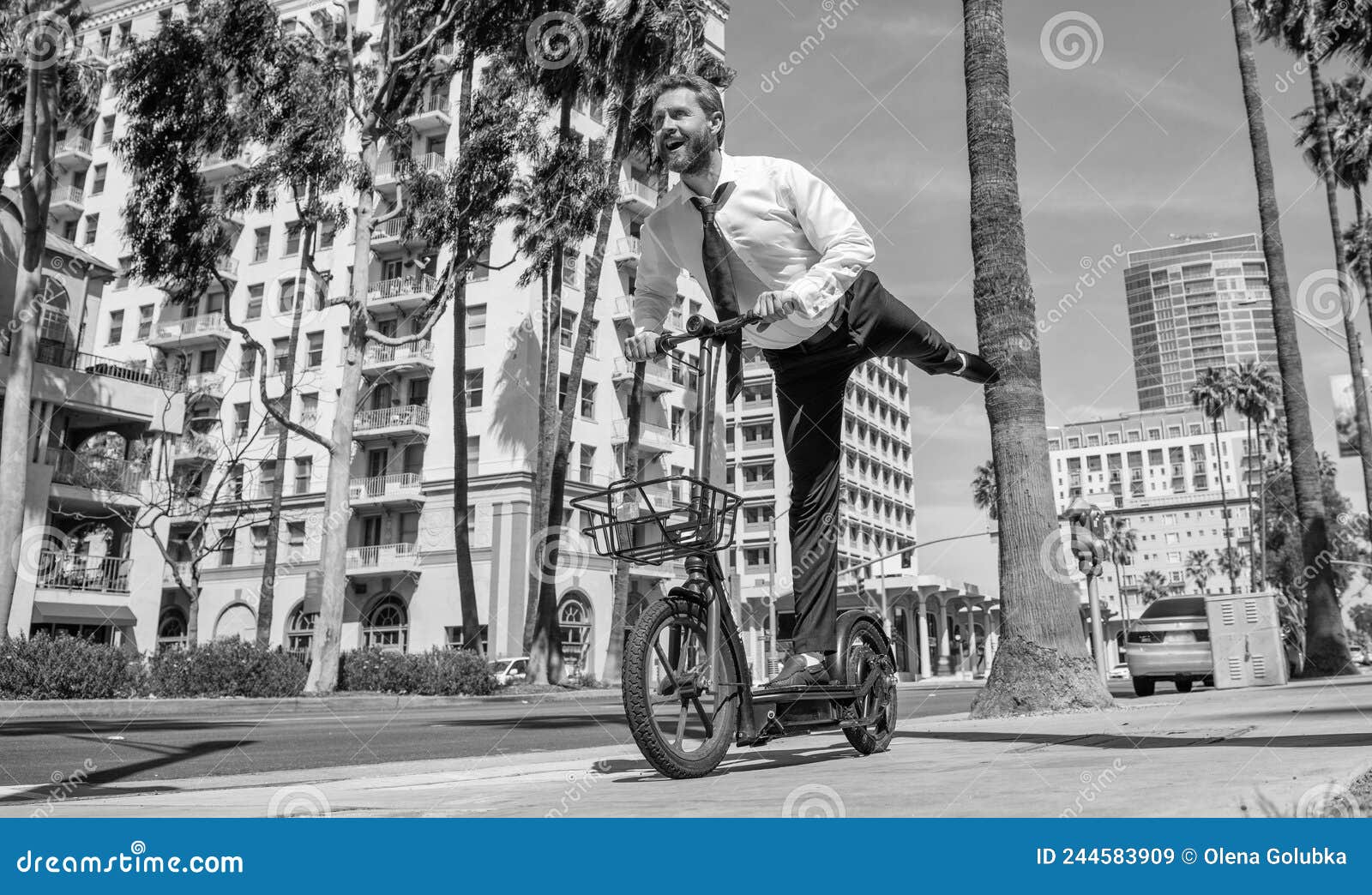 street recreation. happy employer ride escooter on sidewalk. e-scooting for recreation and fun