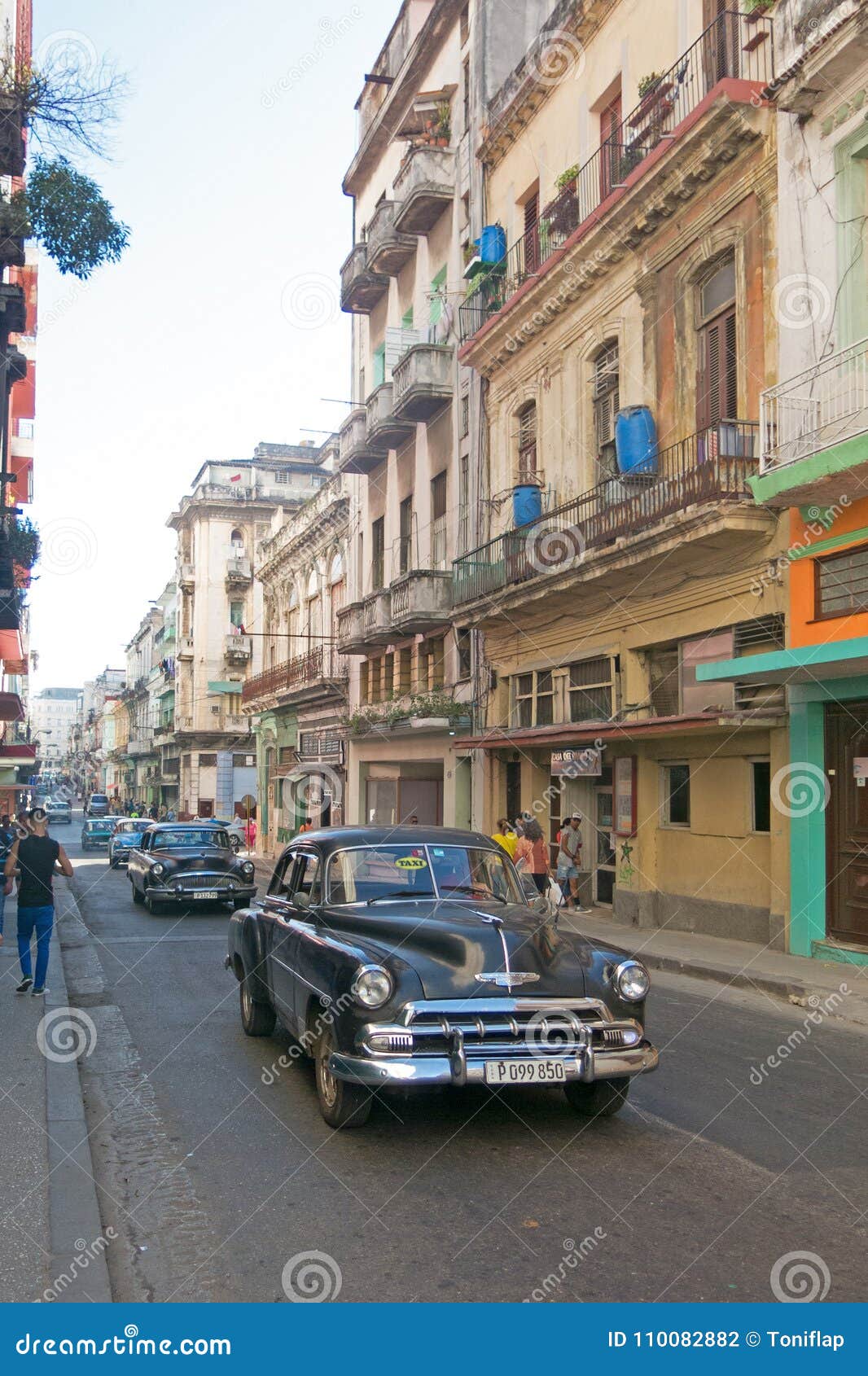 HAVANA, CUBA - JANUARY 16, 2017: Street scene with old american car in downtown Havana, Cuba