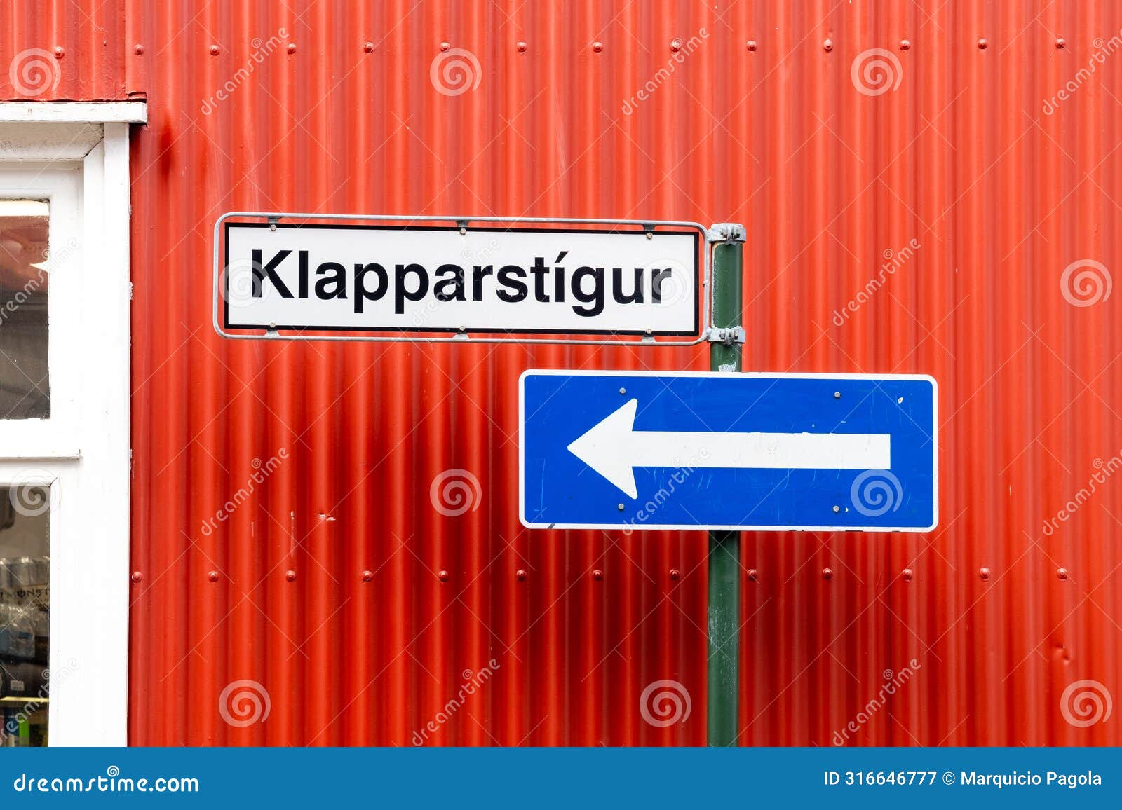 a street sign with the word klapparstigur on it is on a pole