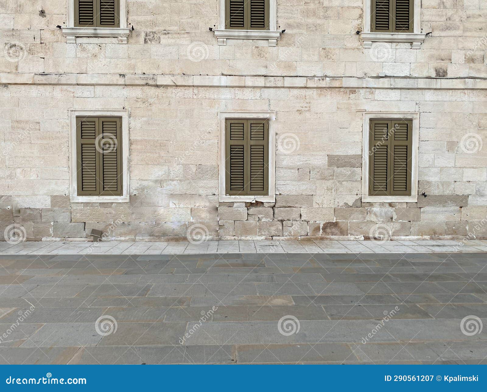 street view of wall with shuttered windows