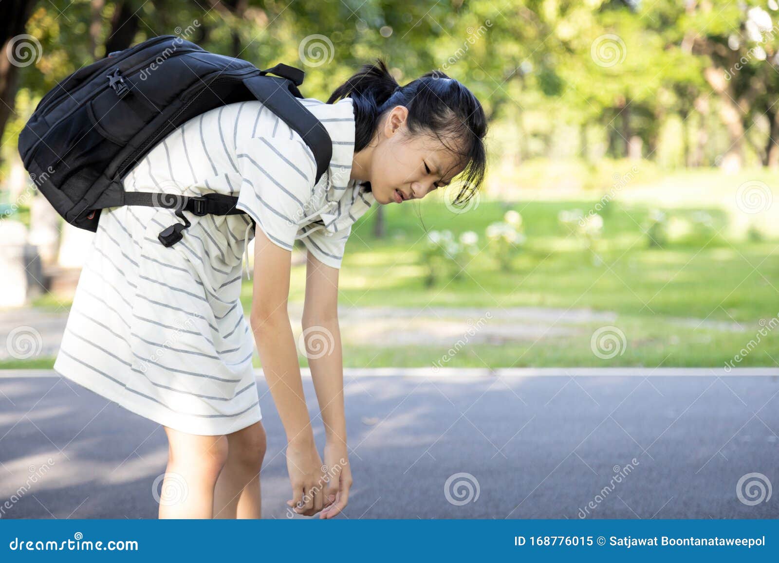 Stress Asian Child Girl Carrying Heavy School Bag or Backpack, Female