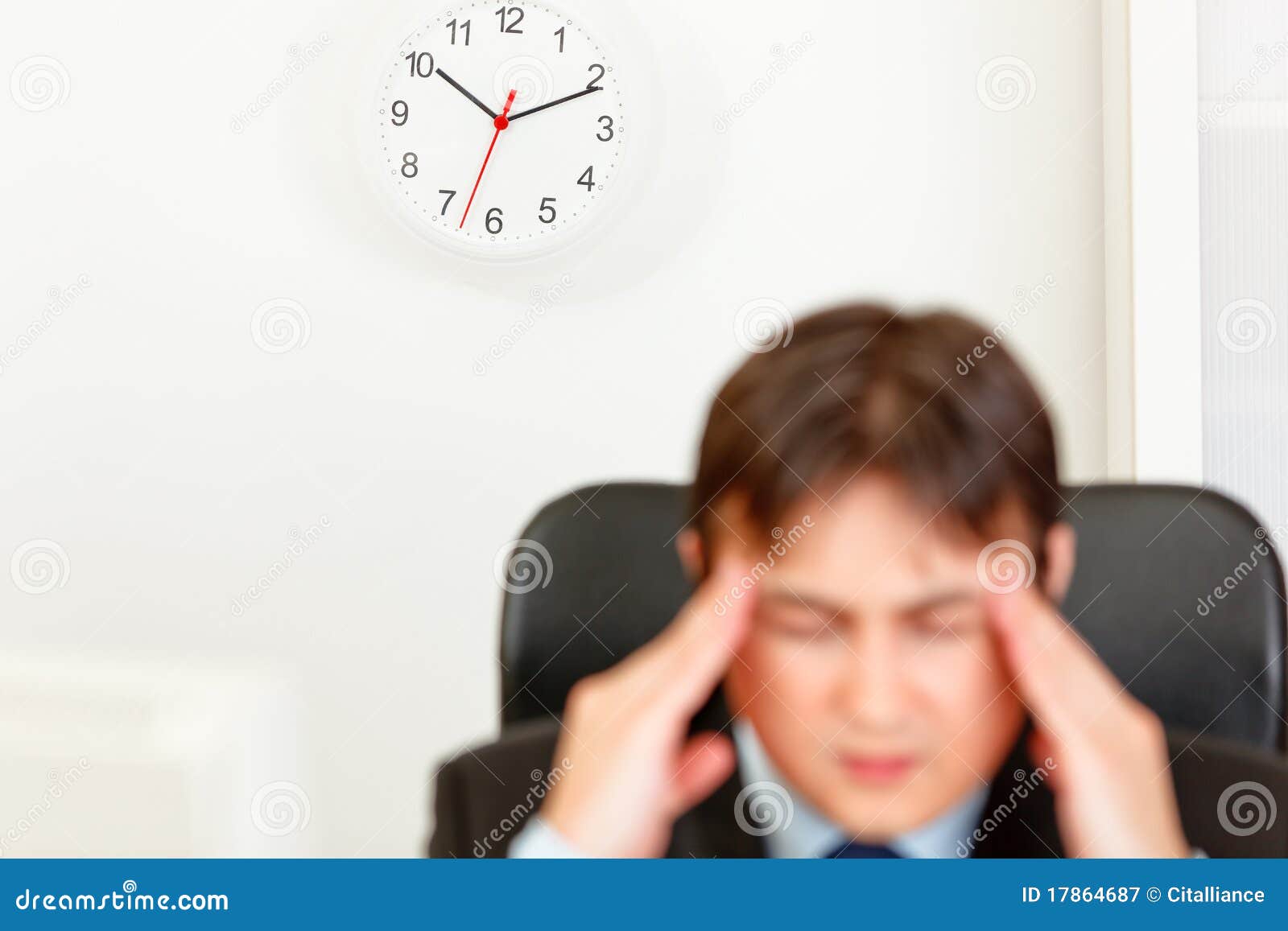 stressed businessman aware of approaching deadline