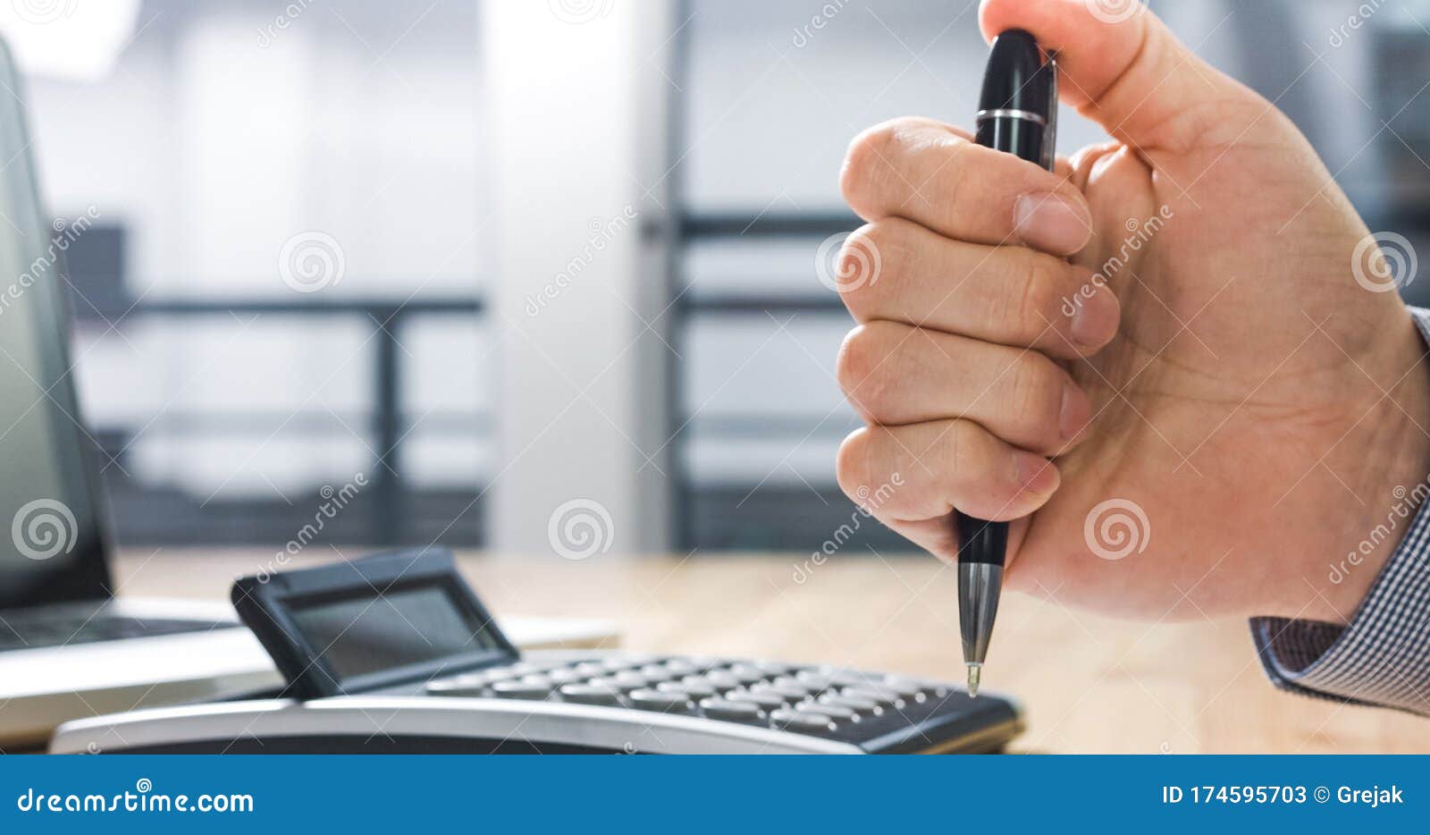 stressed businessman clicking on pen