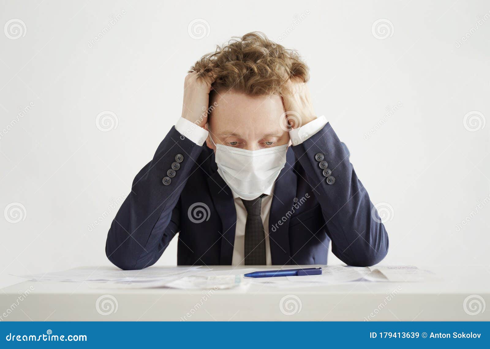 stressed businessman in face mask. lockdown coronavirus