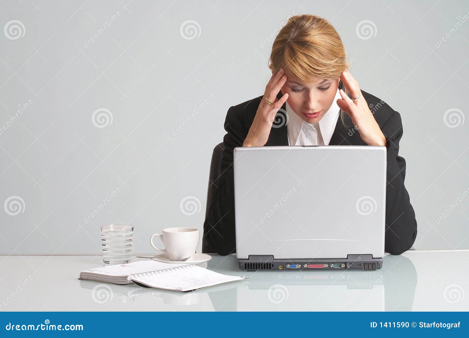 stressed businesswoman with laptop has headache