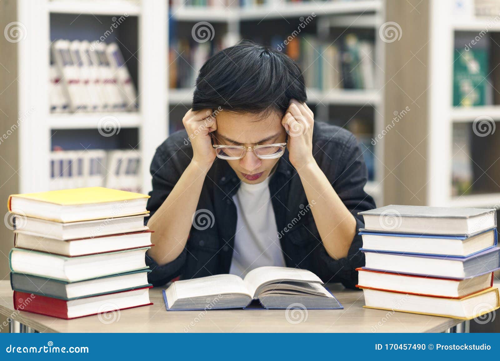 Stressed Chinese Guy Preparing for Examination in Library Stock Photo -  Image of glasses, read: 170457490