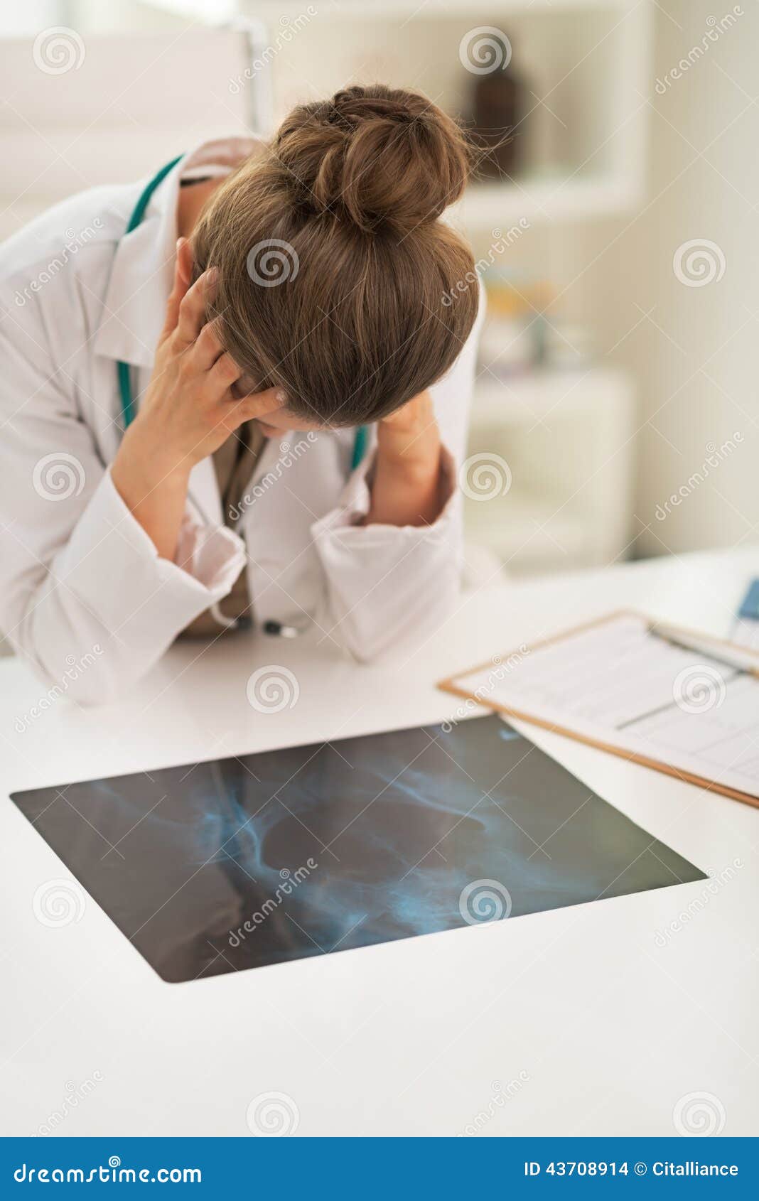 stressed doctor woman with fluorography