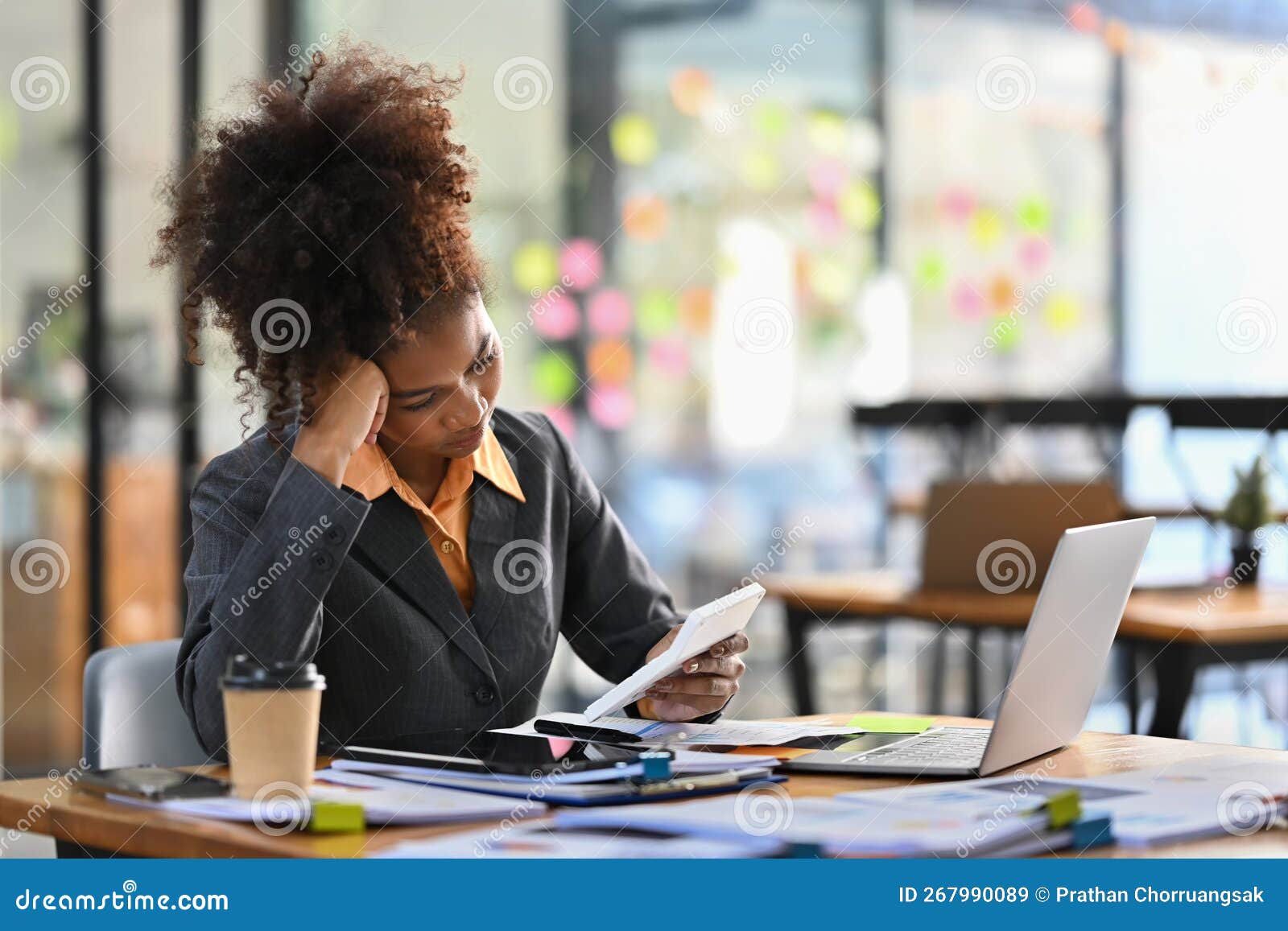 Stressed Female Accountant Working with Financial Document and Using Calculator at Her Office