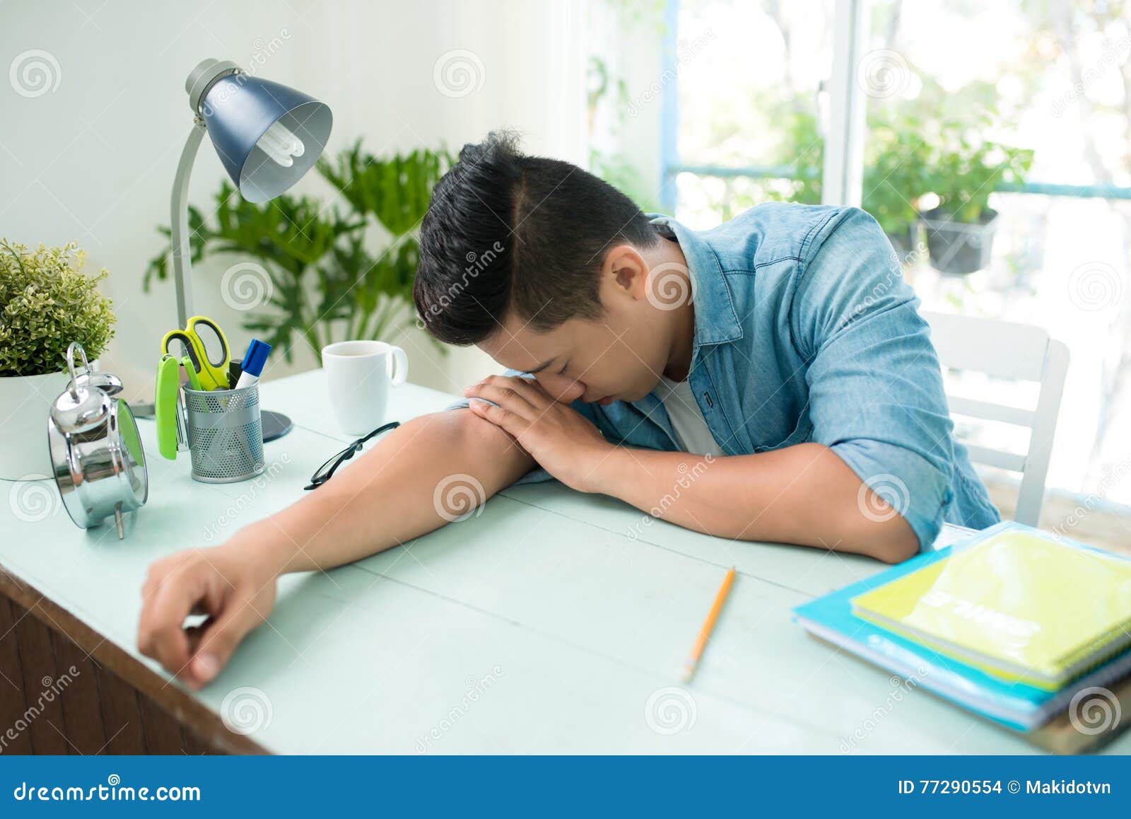 Stressed Overworked Man Studying Sleepy On Desk Stock Photo
