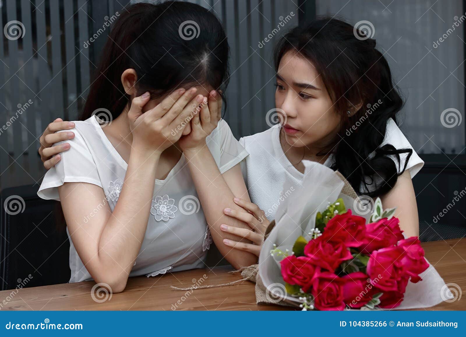 Stressed Young Asian Woman Supporting Depressed Crying Female Friend In