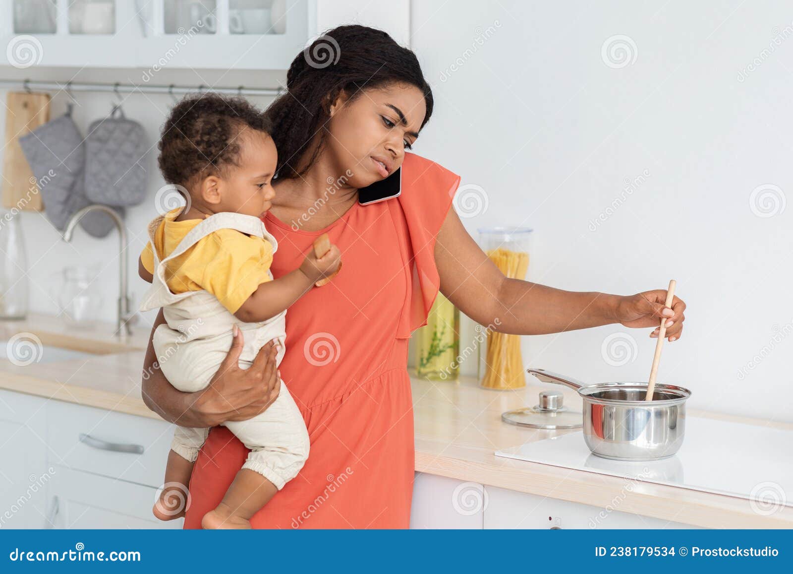 https://thumbs.dreamstime.com/z/stressed-young-black-woman-multitasking-kitchen-baby-hands-stressed-young-black-woman-multitasking-kitchen-baby-238179534.jpg