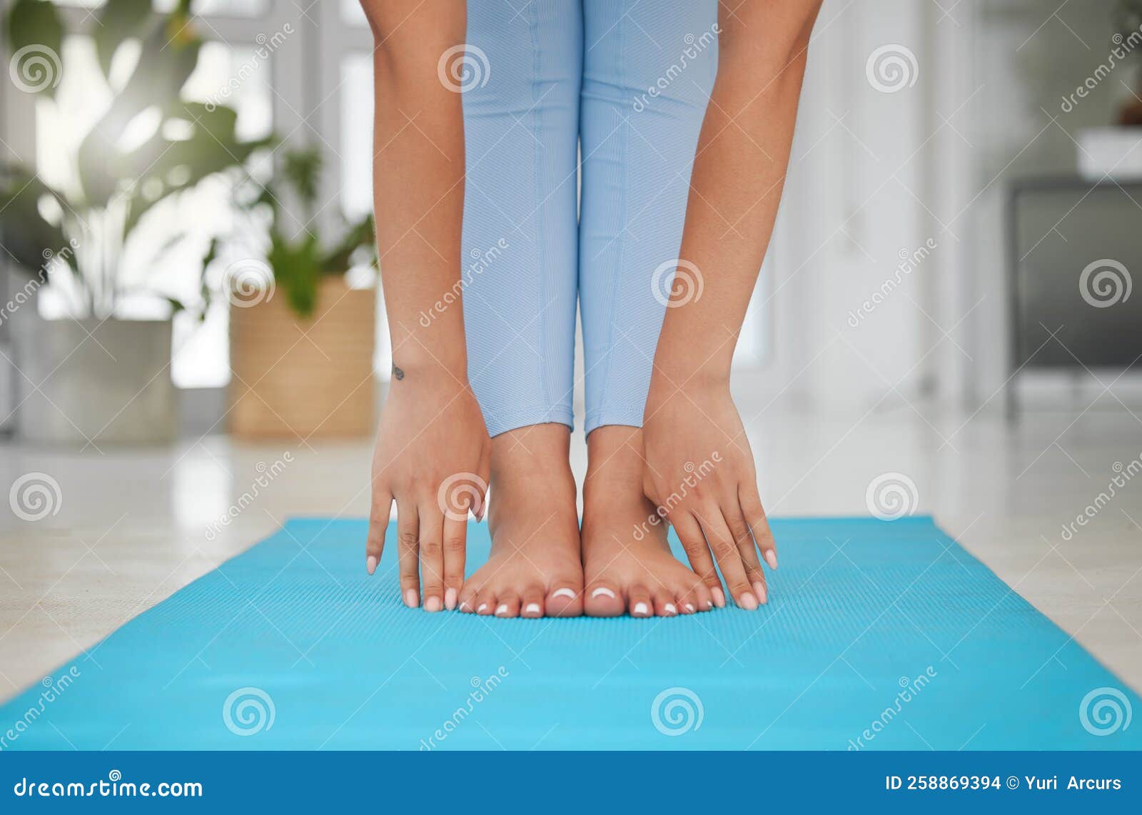 Women's bare feet connection on yoga cushions - Stock Image - F017