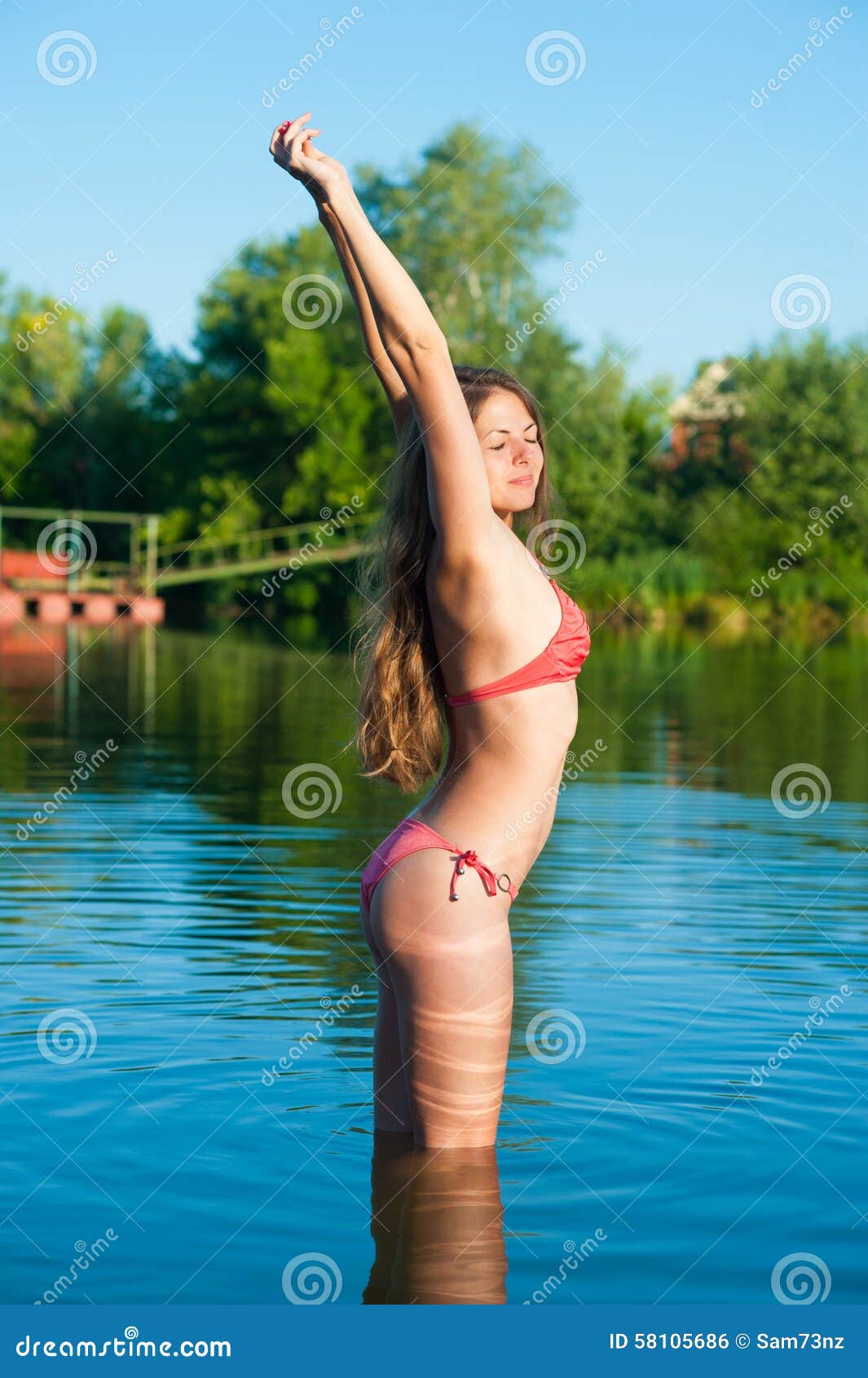 Stretching Girl in Bikini into Lake Stock Photo - Image of fashion