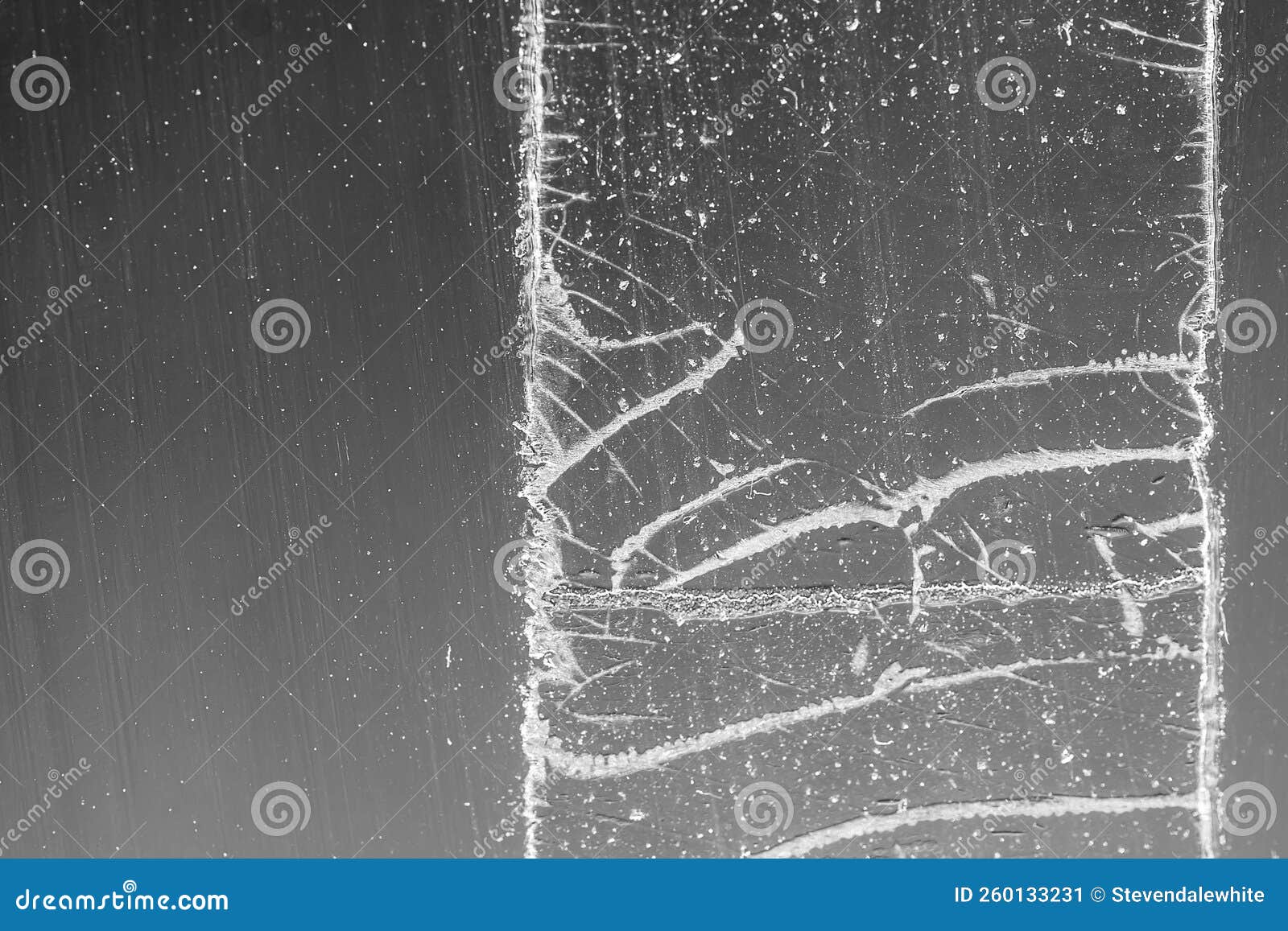 Strip of Tape Adhesive on a Glass Surface after Being Pulled. Stock