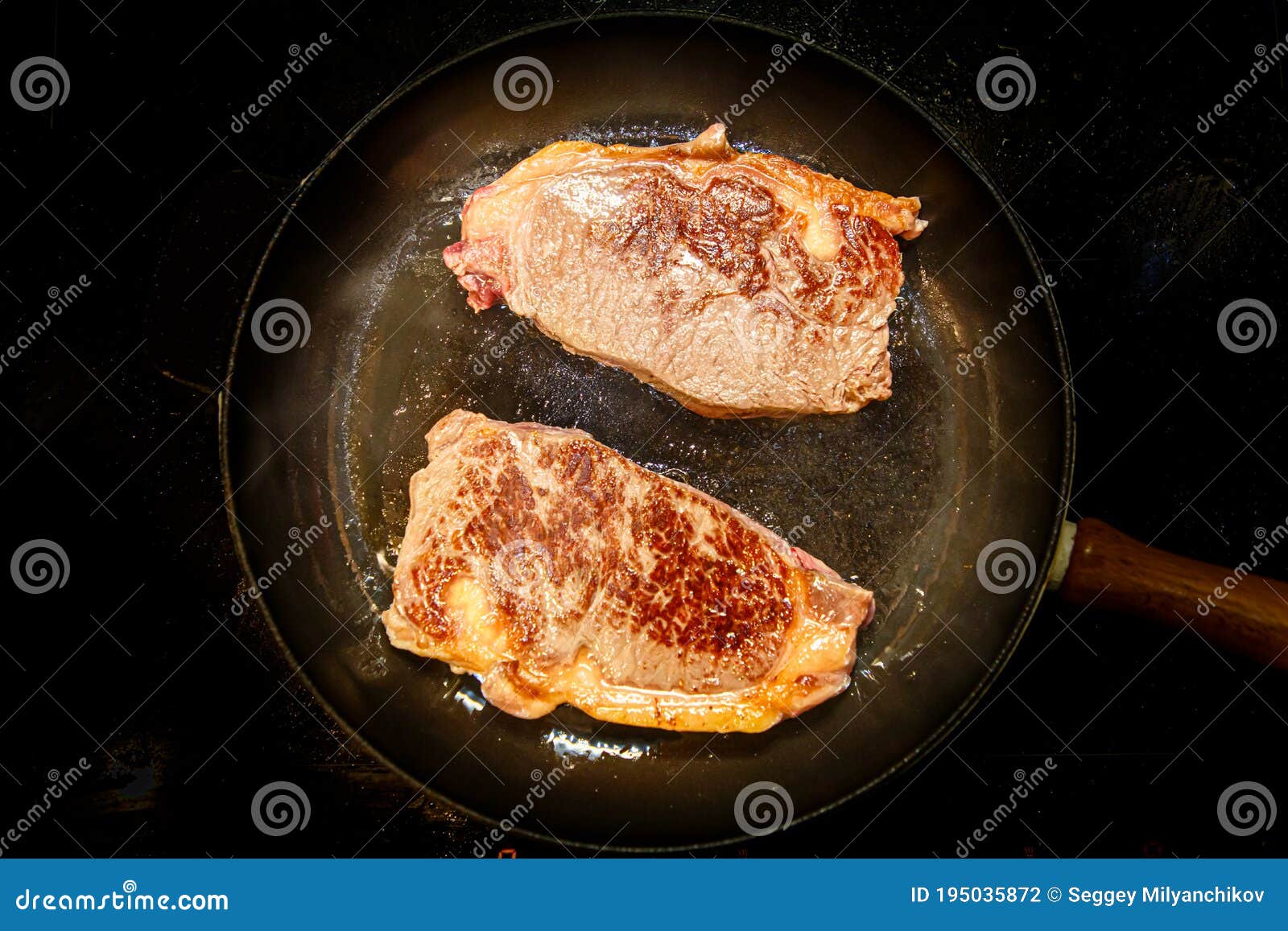 Striploin Steak New York of Marbled Beef is Fried in a Black Pan Stock Photo Image of kitchen