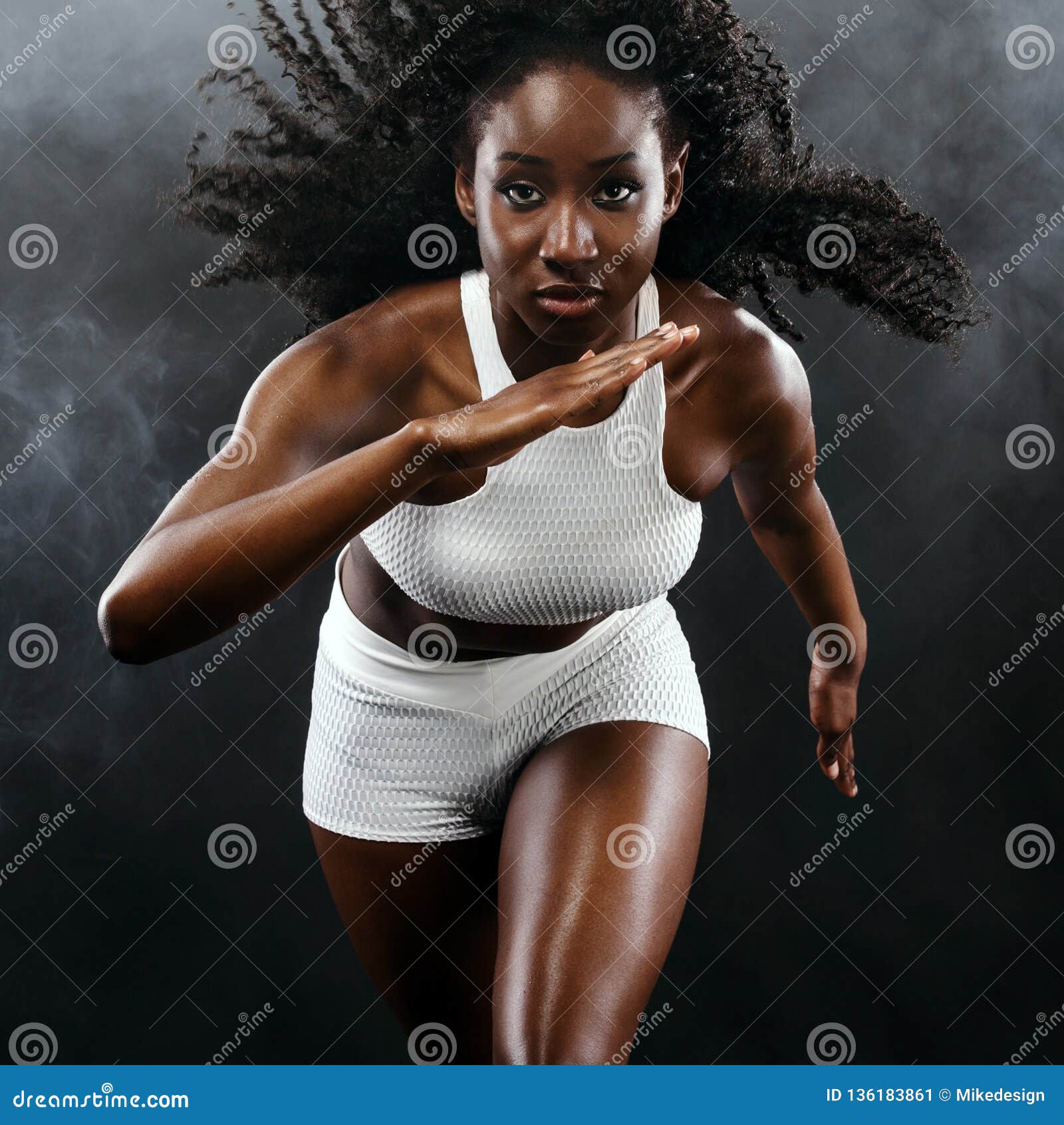 Strong Athletic Black Skin Woman Sprinter, Running on Background