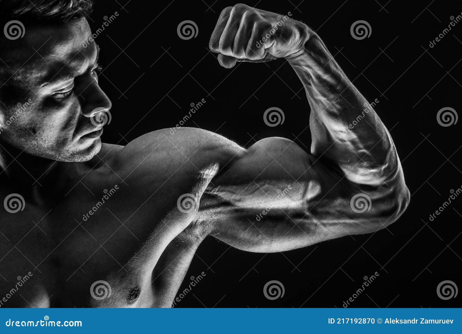 Strong Athletic Muscular Man on Black Background Showing Biceps Stock ...