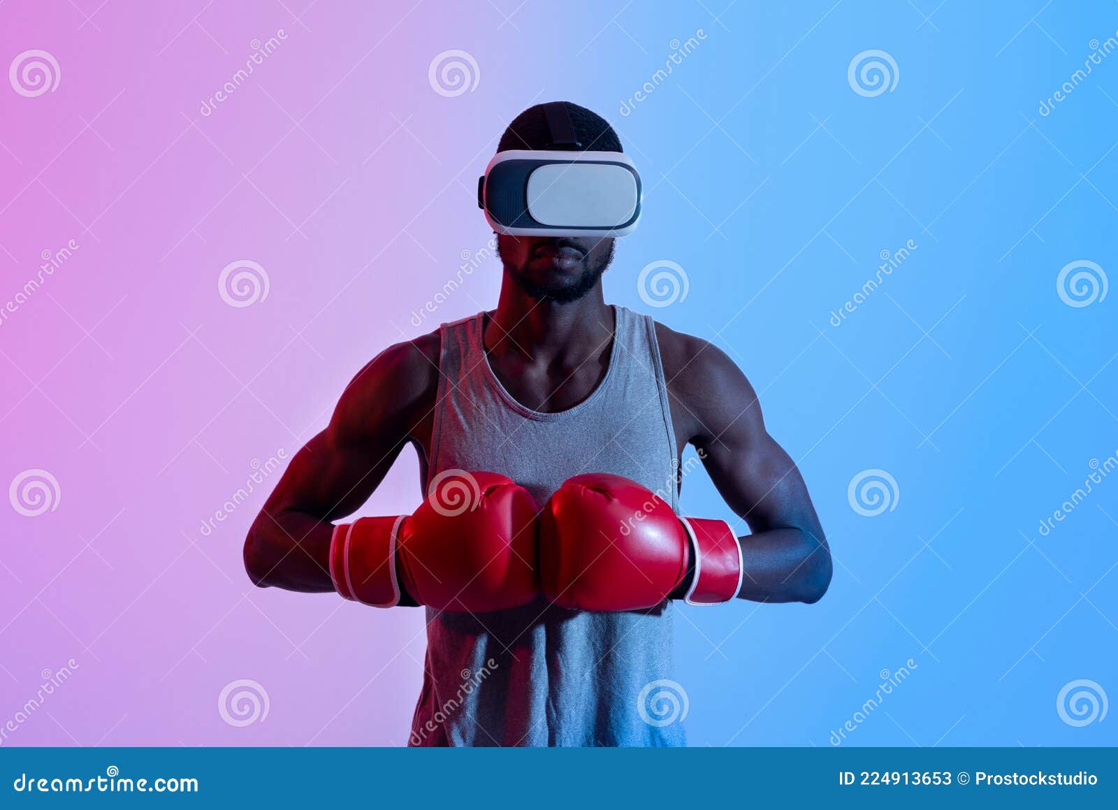 Strong Black Sportsman in VR Headset Putting Boxing Gloves Together in Neon Light Stock Image