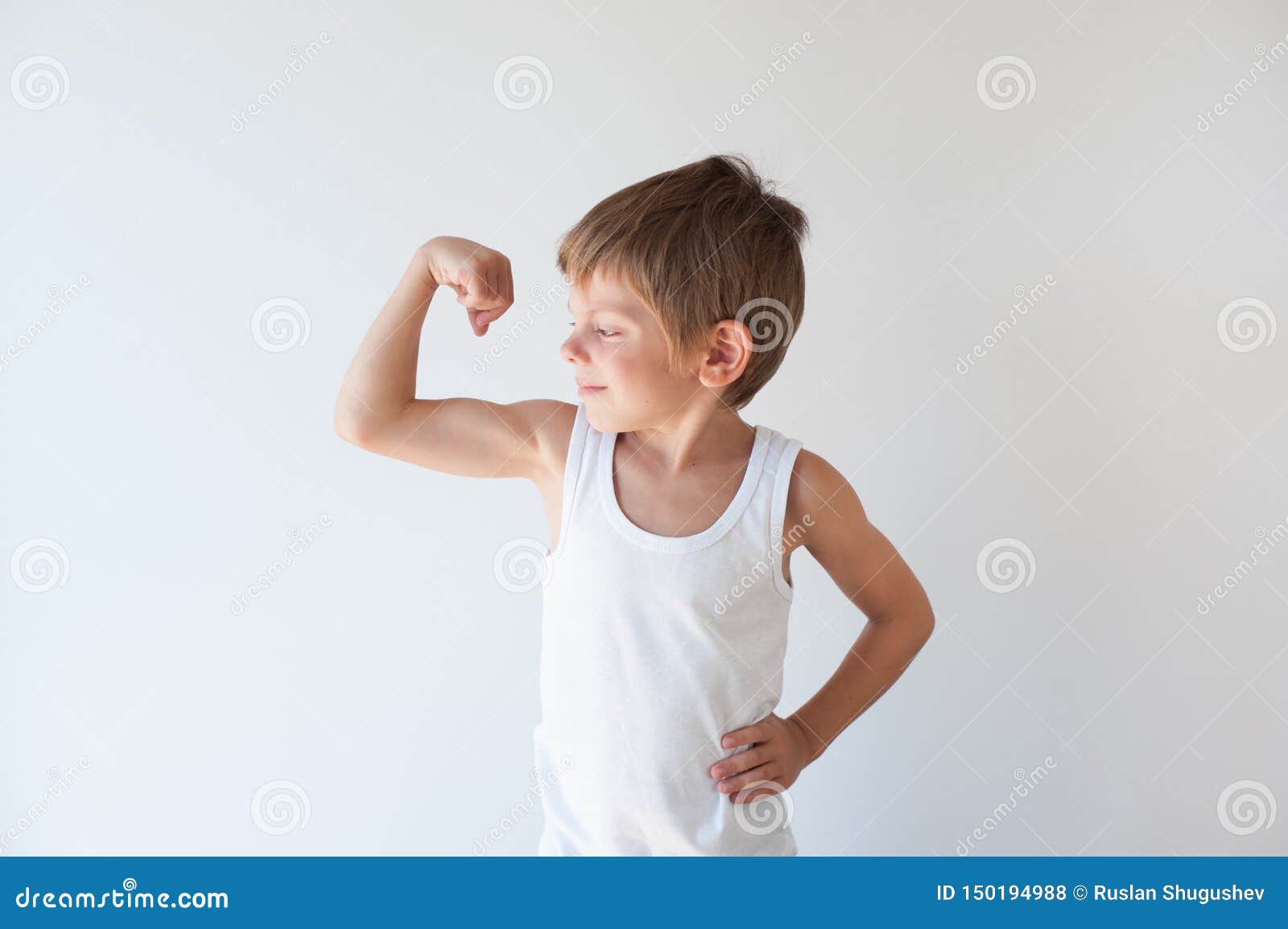 Strong Little Caucasian Boy in White Tank Top Showing Muscles with Smile on  His Face Stock Photo - Image of muscle, hand: 150194988