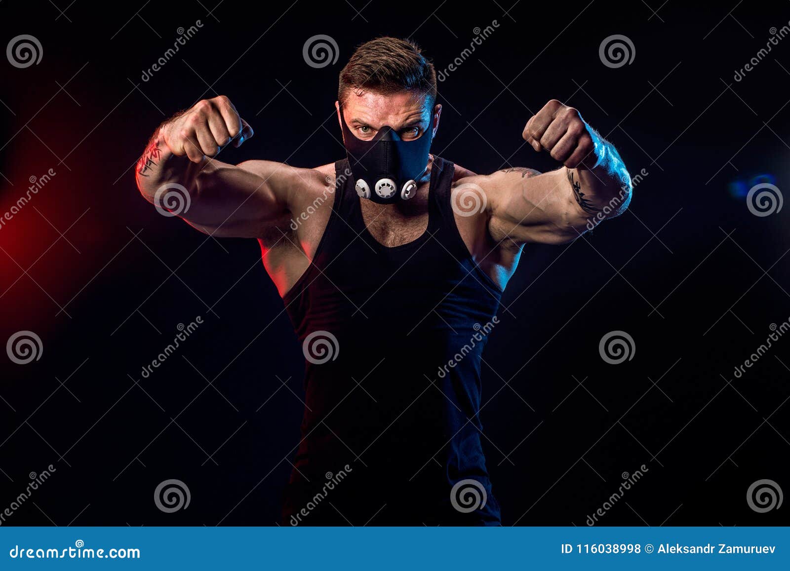 Strong Male Athlete in a Black Training Mask on a Black Background Stock Photo Image of