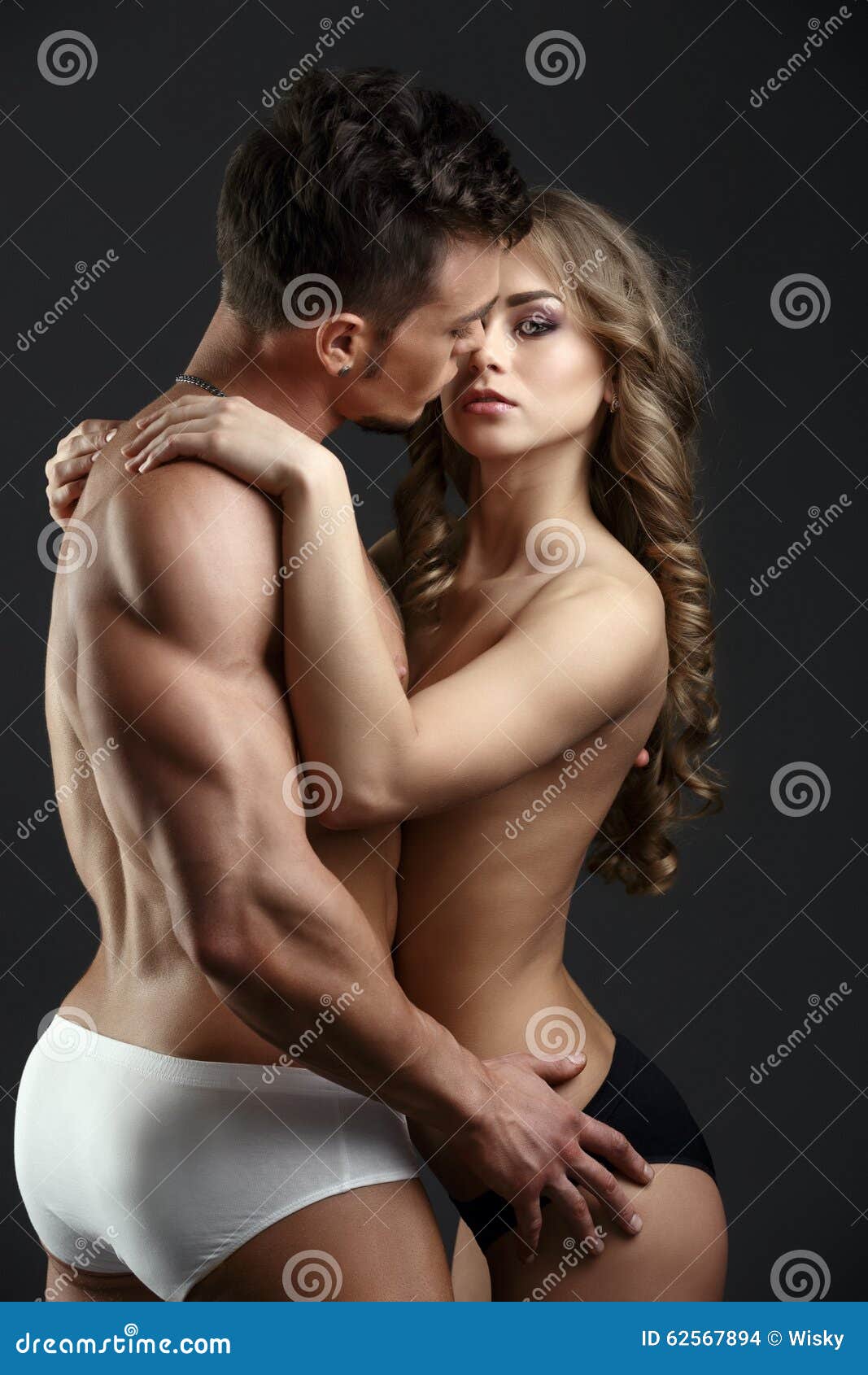 Strong Man and Beautiful Woman Posing Half-naked Stock Photo image pic