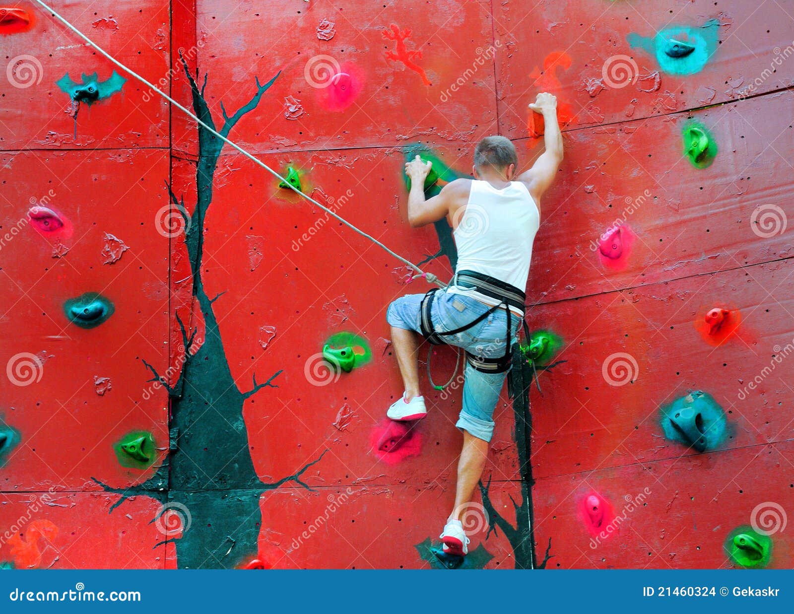 Strong Man Climbing on a Climbing Wall Stock Photo Image of male