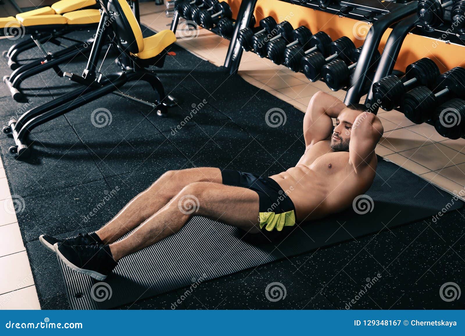 Strong Man Doing Crunches on Mat Stock Image Image of floor, lifestyle 129348167