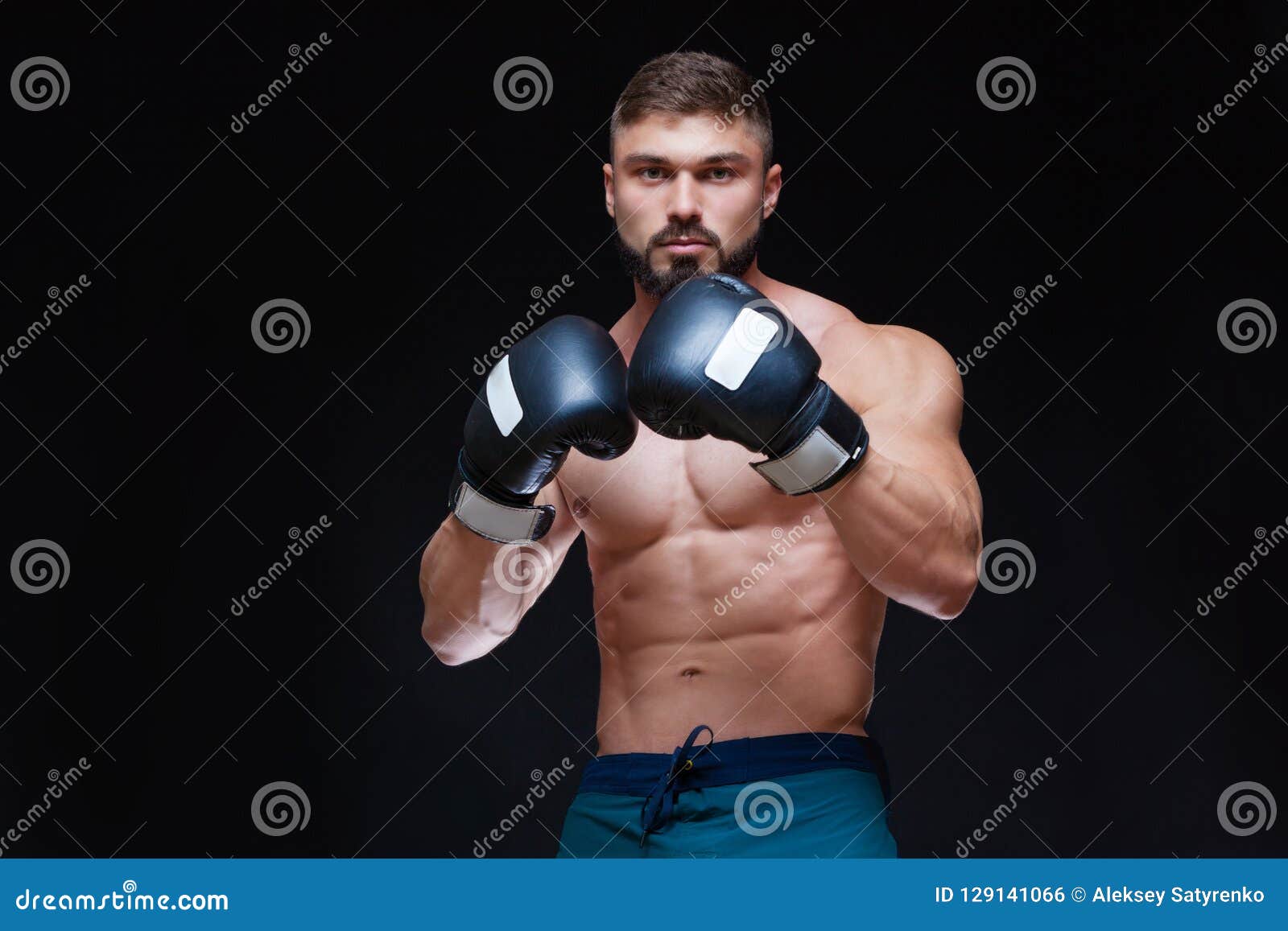 Strong Muscular Boxer in Black Boxing Gloves. Isolated on Black ...