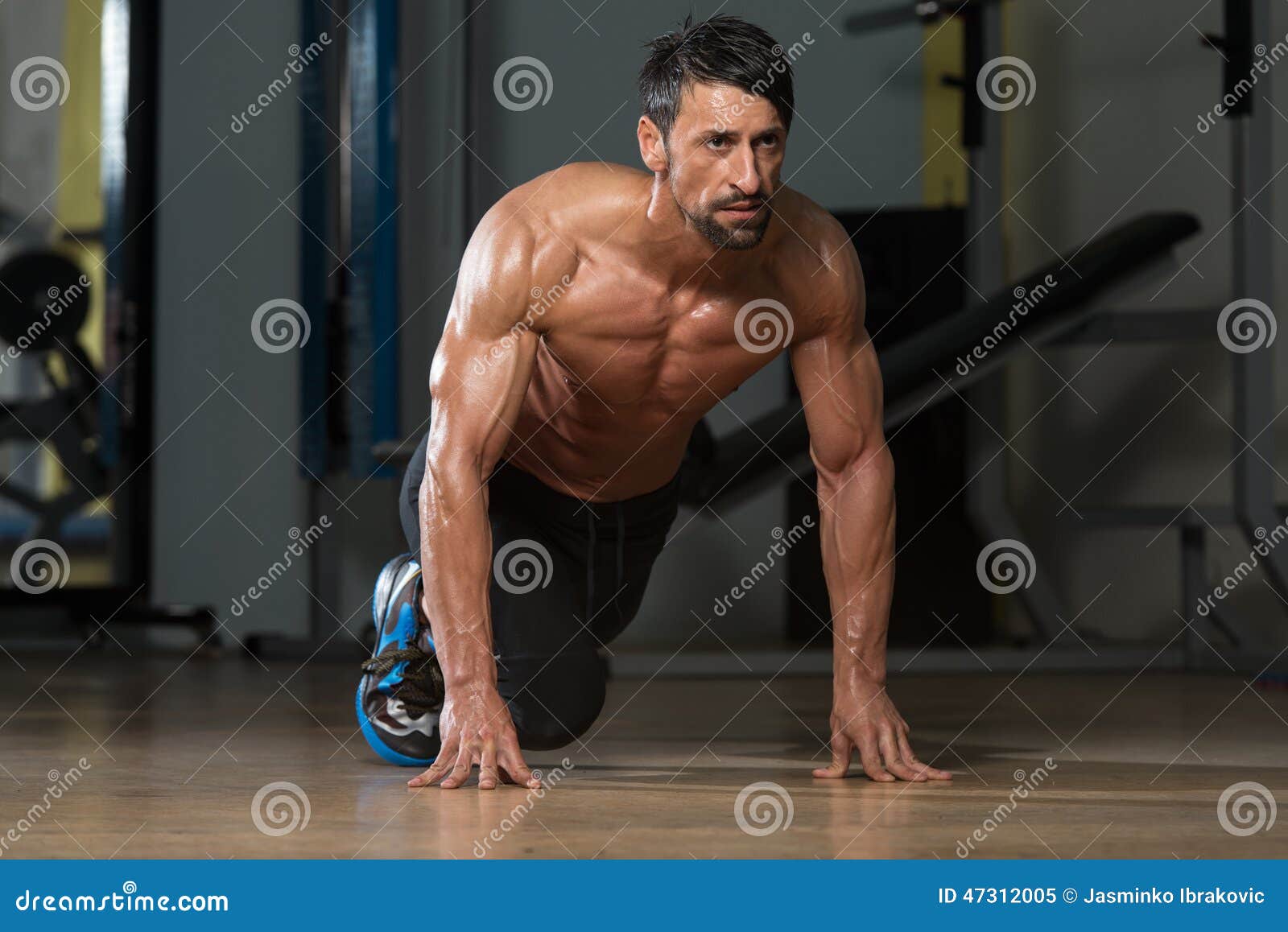 Strong Muscular Men Kneeling On The Floor Stock Image CartoonDealer