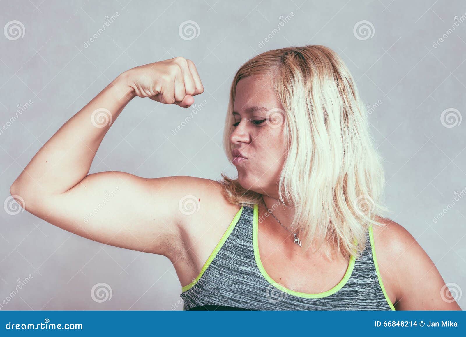 female muscular arm stock photos - OFFSET