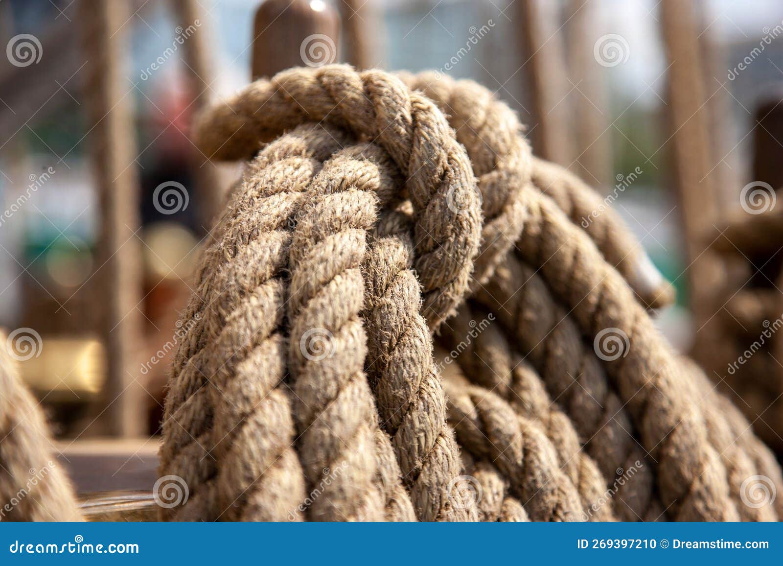 Strong Ropes for Sailing Hanging on a Wooden Pole Stock Photo