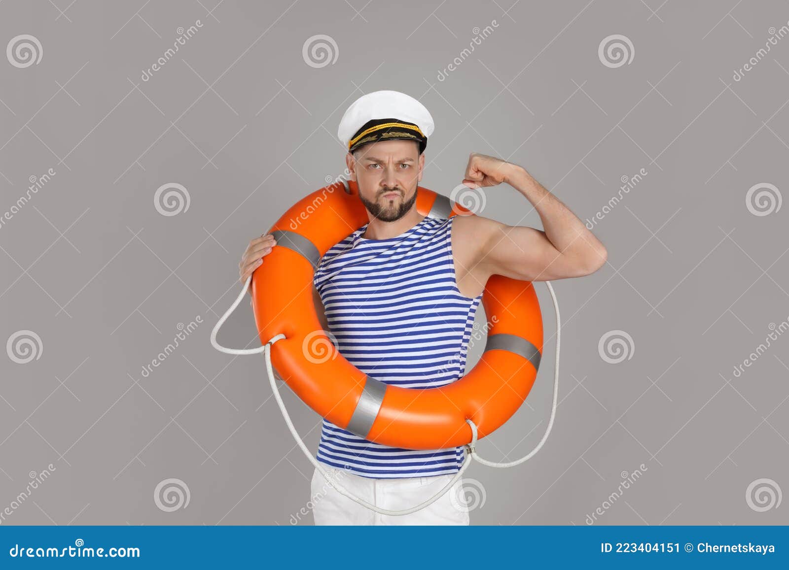 Strong Sailor with Orange Ring Buoy Showing Biceps on Grey Background ...