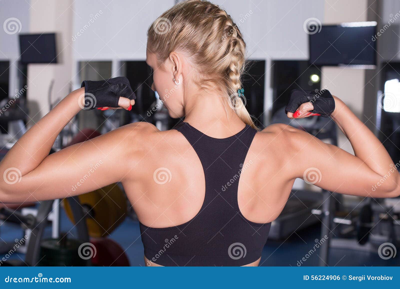 Strong Beautiful Fitness Woman Flexing Her Arm and Back Muscles Stock Photo  - Image of cross, energy: 83710682