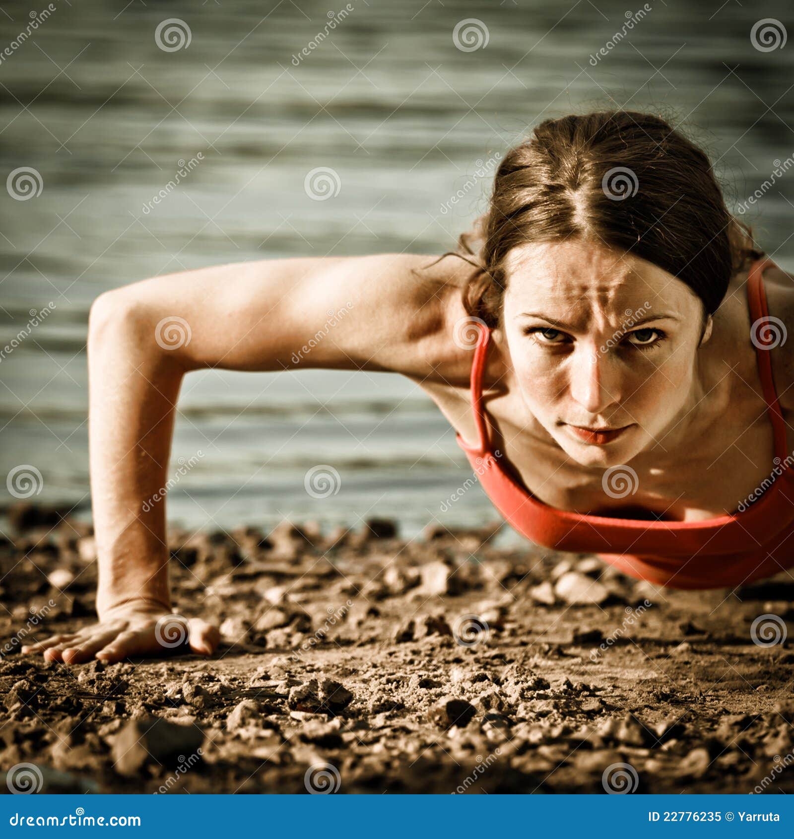 A Strong Girl With Big Muscular Arms On A Beach Stock Photo, Picture and  Royalty Free Image. Image 18043673.