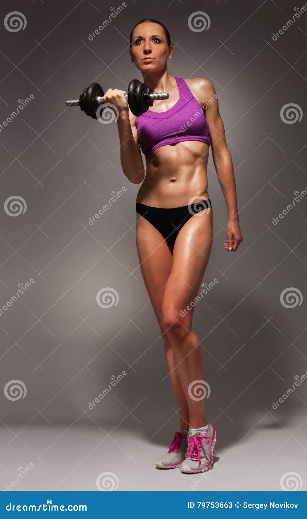 Fit healthy young woman with a strong body