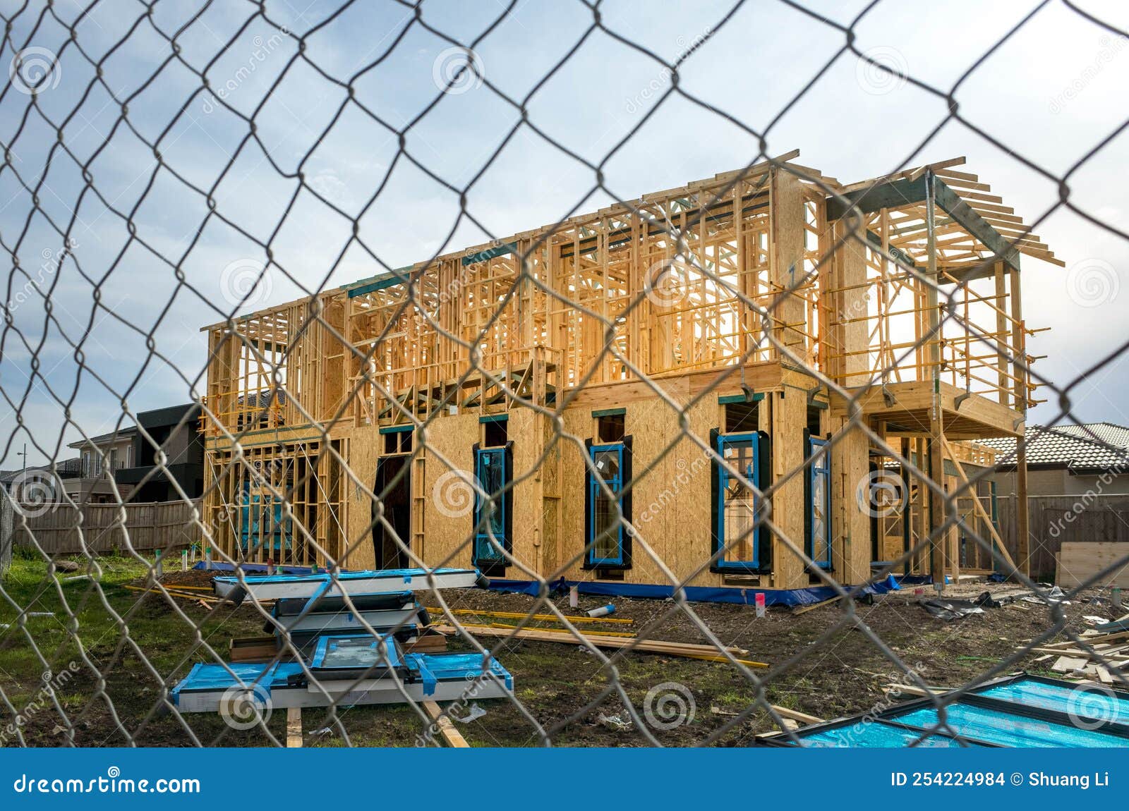 the structure of a two-story residential suburban house under construction. concept of real estate development, self-build a new