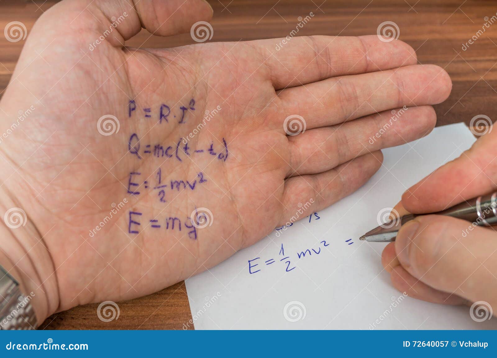 student is cheating during exam with cheat sheet with formula.