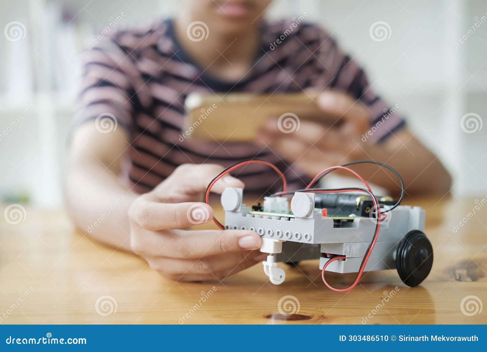 student doing robot project in science technology of robotics programing and stem education concept.