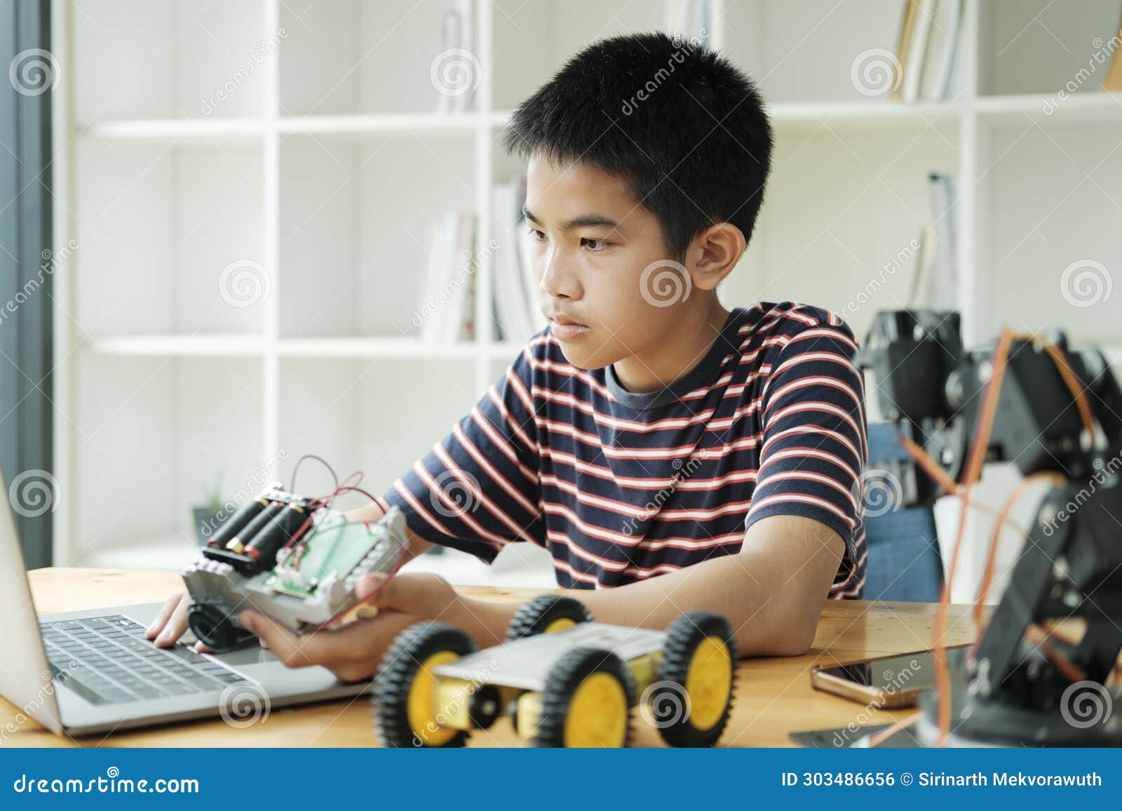 student doing robot project in science technology of robotics programing and stem education concept.