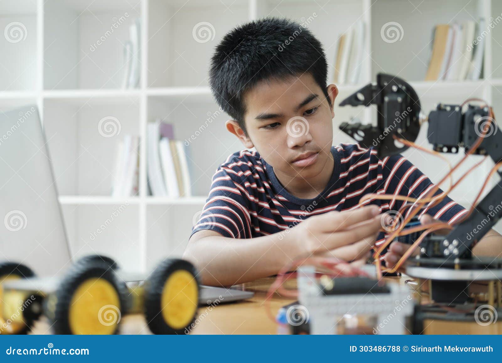 student doing robot project in science technology of robotics programing and stem education concept.