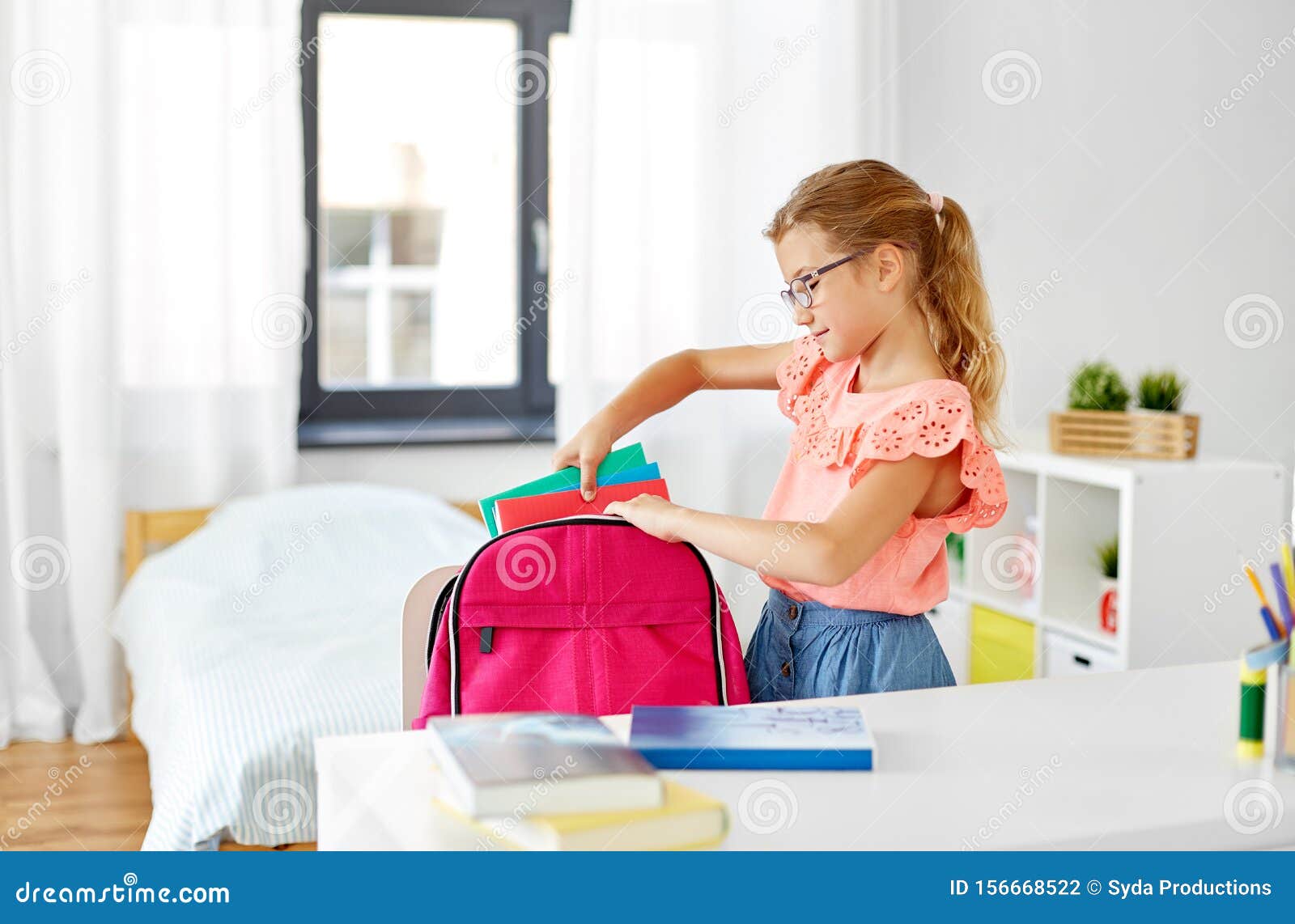 Girl packing her schoolbag illustration Stock Vector Image & Art
