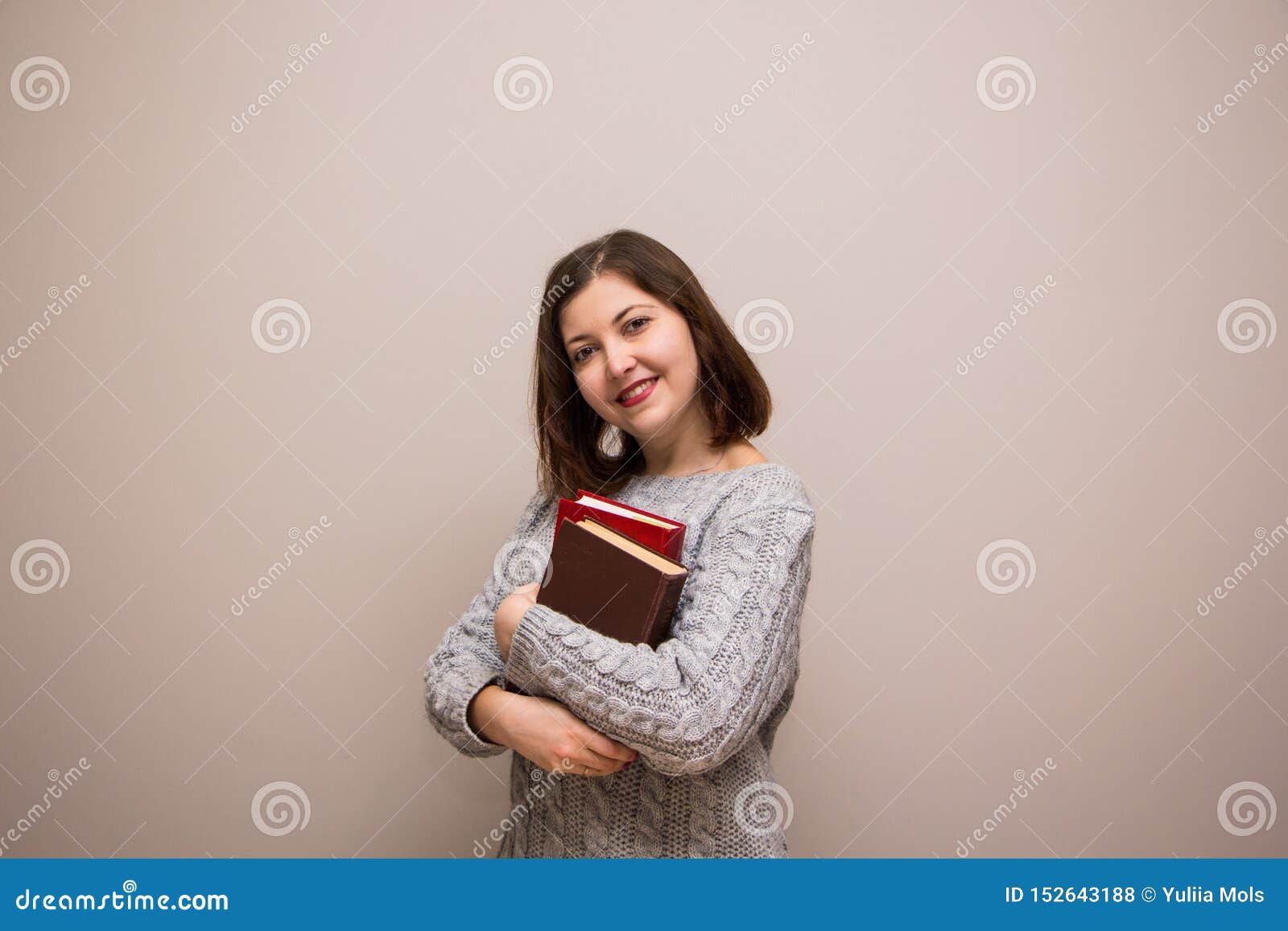 student girl with stack of books