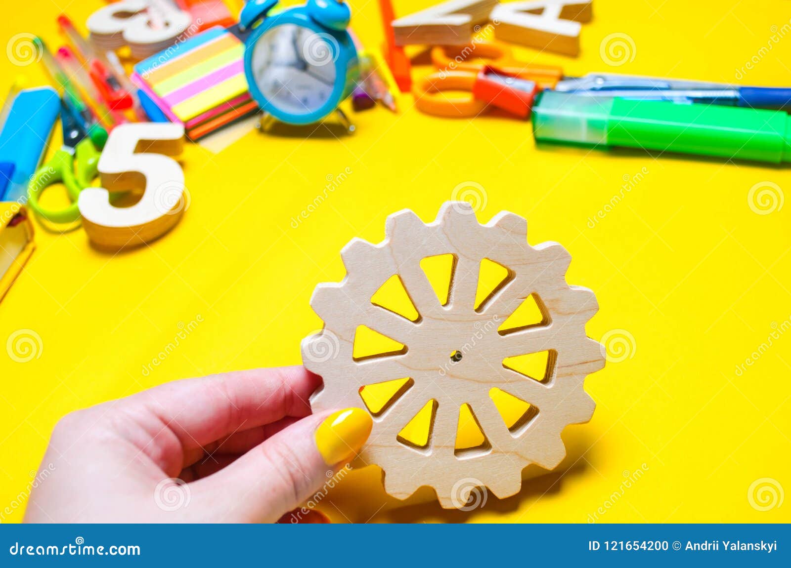 The Student Holds a Gear in His Hands. Educational Process. Principle