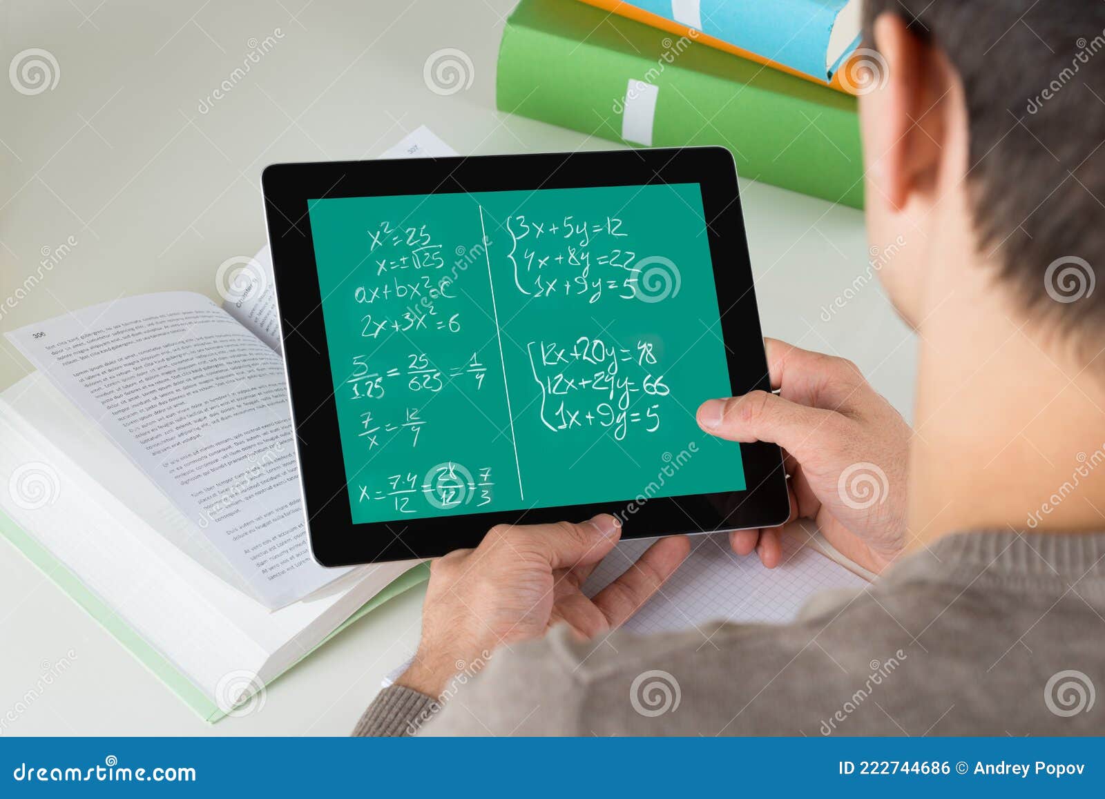 student learning mathematical equations on digital tablet