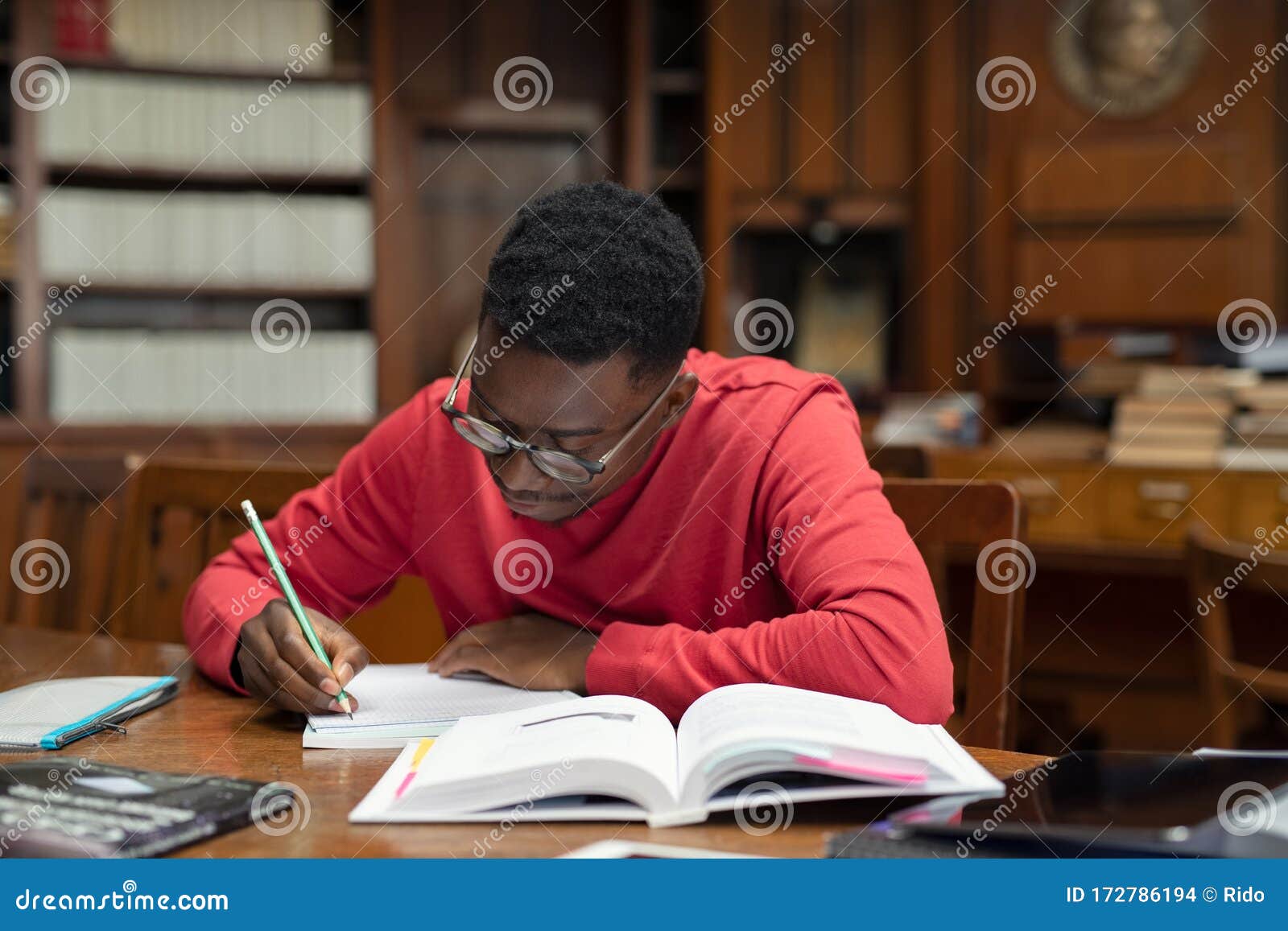 Student in Library Studying for Exam Stock Photo Image of homework