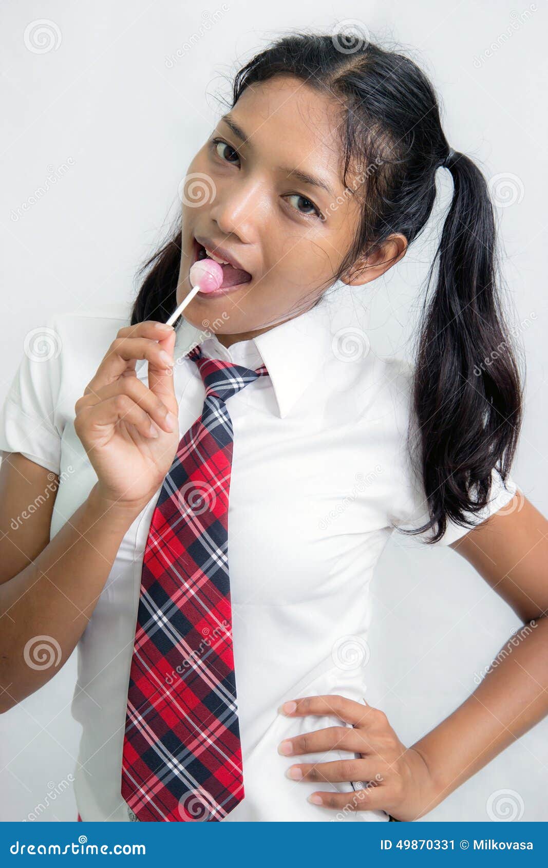 Student licking lollipop stock image. Image of education 49870331