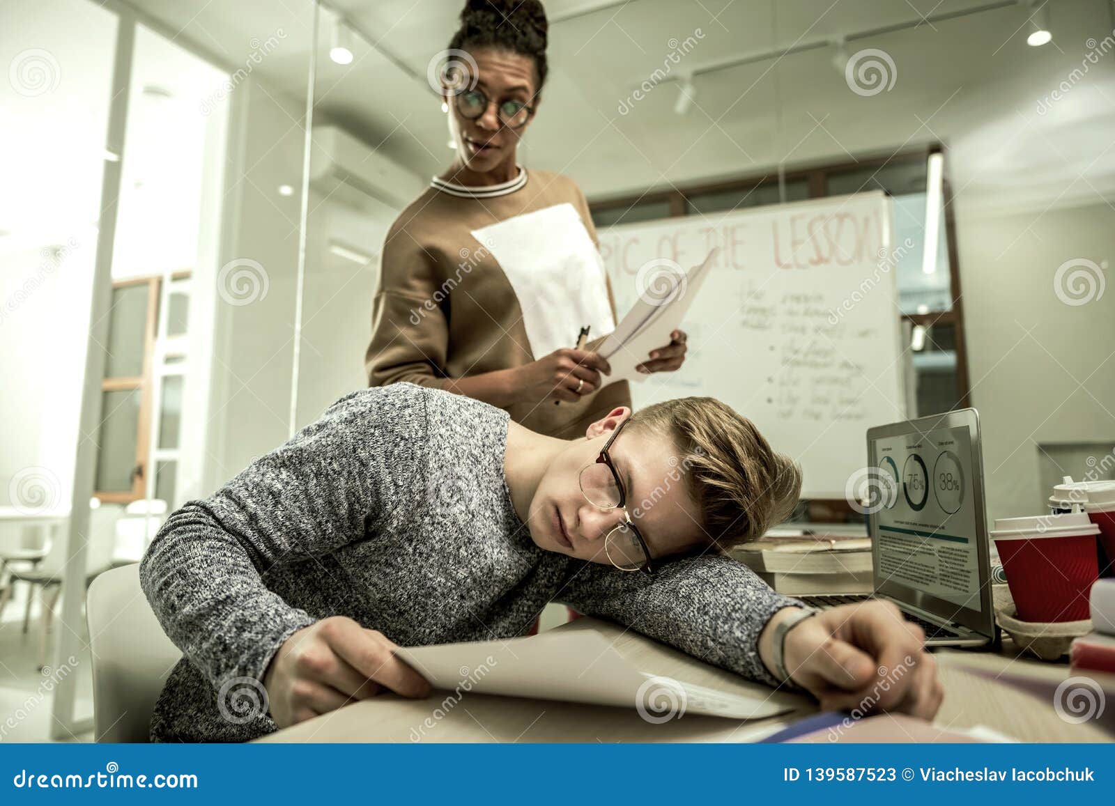 Student Pretending Not To Listen To His Teacher Standing Near Him Stock  Image - Image of classroom, discussion: 139587523