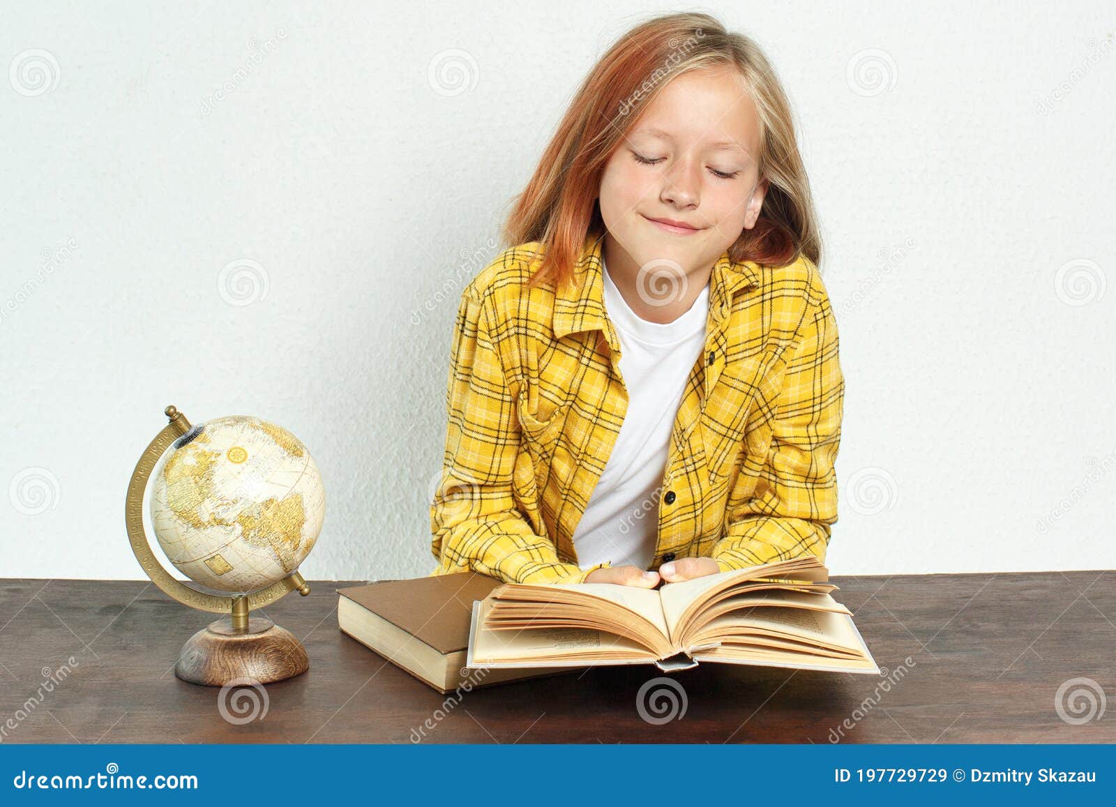 A Student Reads a Book. Near Books and a Globe Stock Image Image of