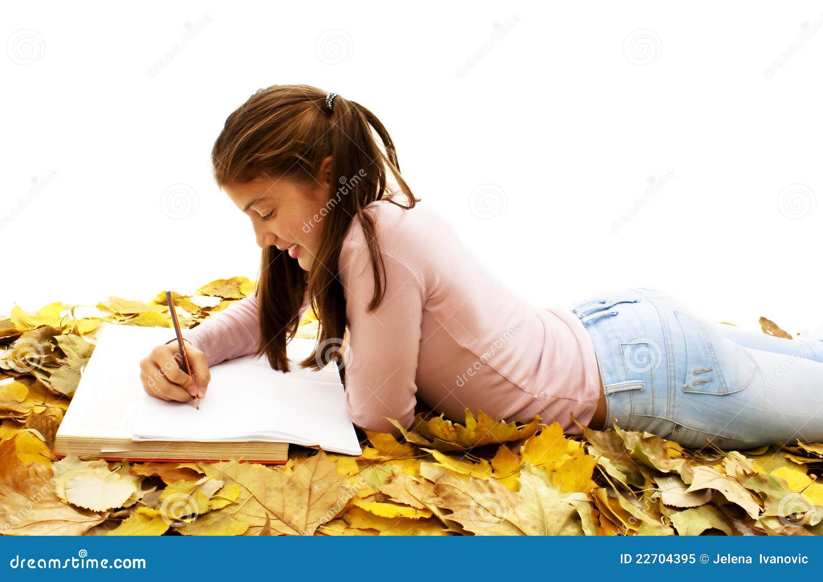 Student Teenage Girl Lying Down With Leaves Around Stock ...